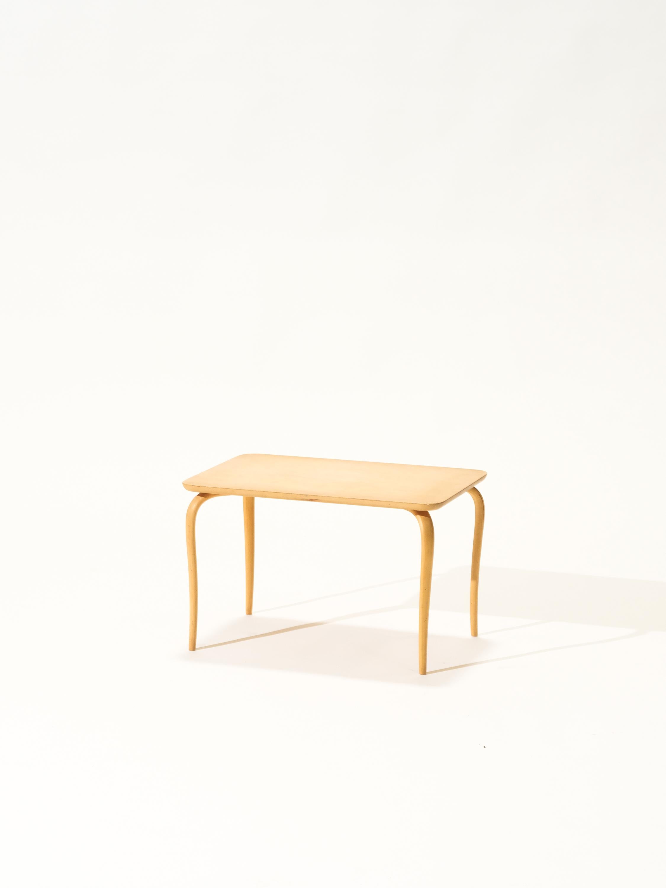 Bruno Mathsson coffee table model 'Annika'. This coffee table has birch plywood legs, which are fluently curved and tapered. These light legs are elegantly built and give this piece its unique appearance. Simple yet very graceful.