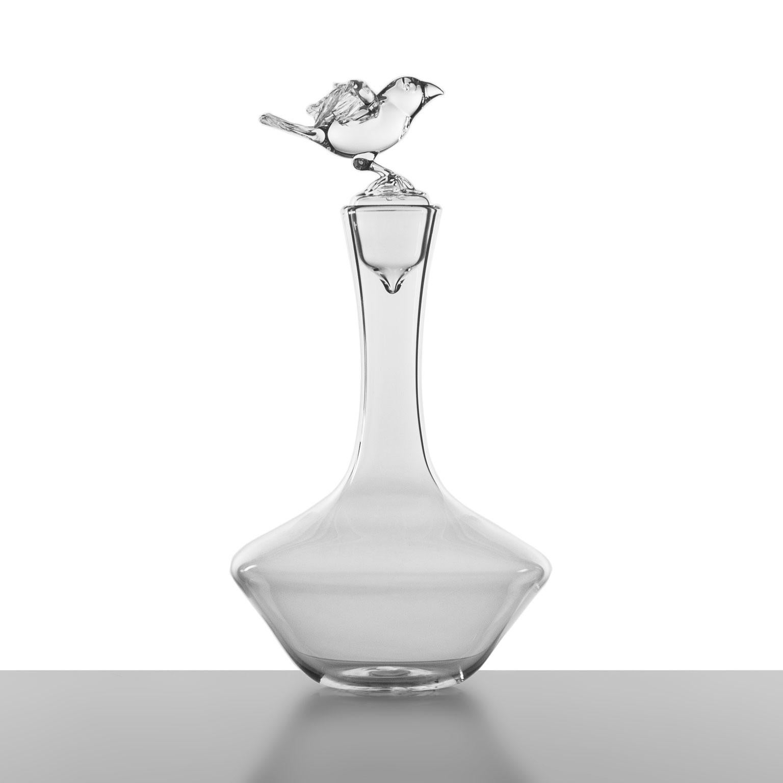 'Bird Bottle'
A hand blown glass bottle by Simone Crestani

A tiny creature, master of balance, spreads its wings, ready to answer the call of flight. The simple beauty of a little bird is captured in this bottle in the exact instant before the