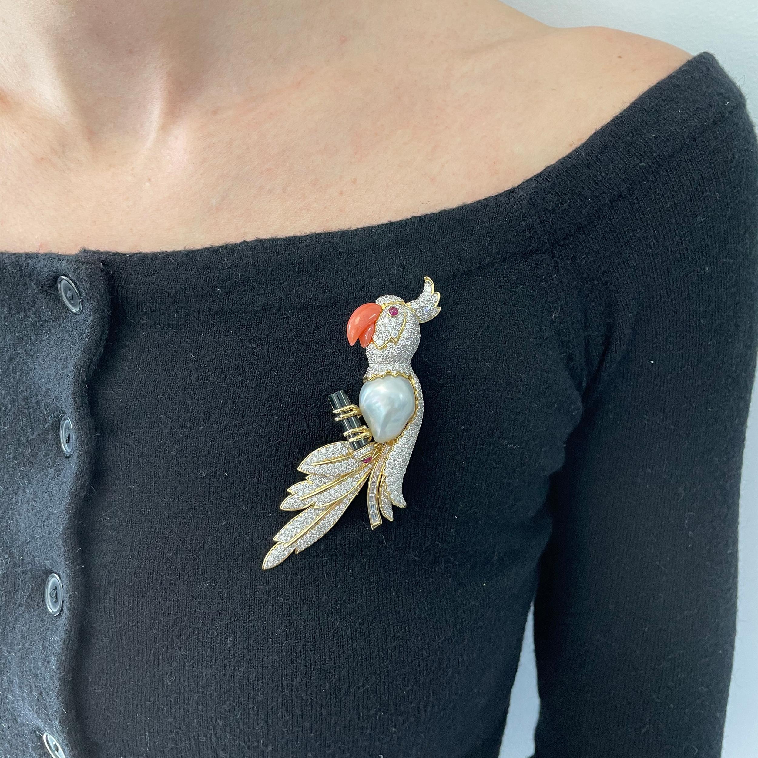 Parrot brooch made in 18k yellow gold with gemstone accents.
The parrot's head, feathers and tail encrusted with approximately 390
round brilliant cut and 8 baguette cut diamonds weighing total of approximately 9.50ct-10.50carats color H-I, clarity