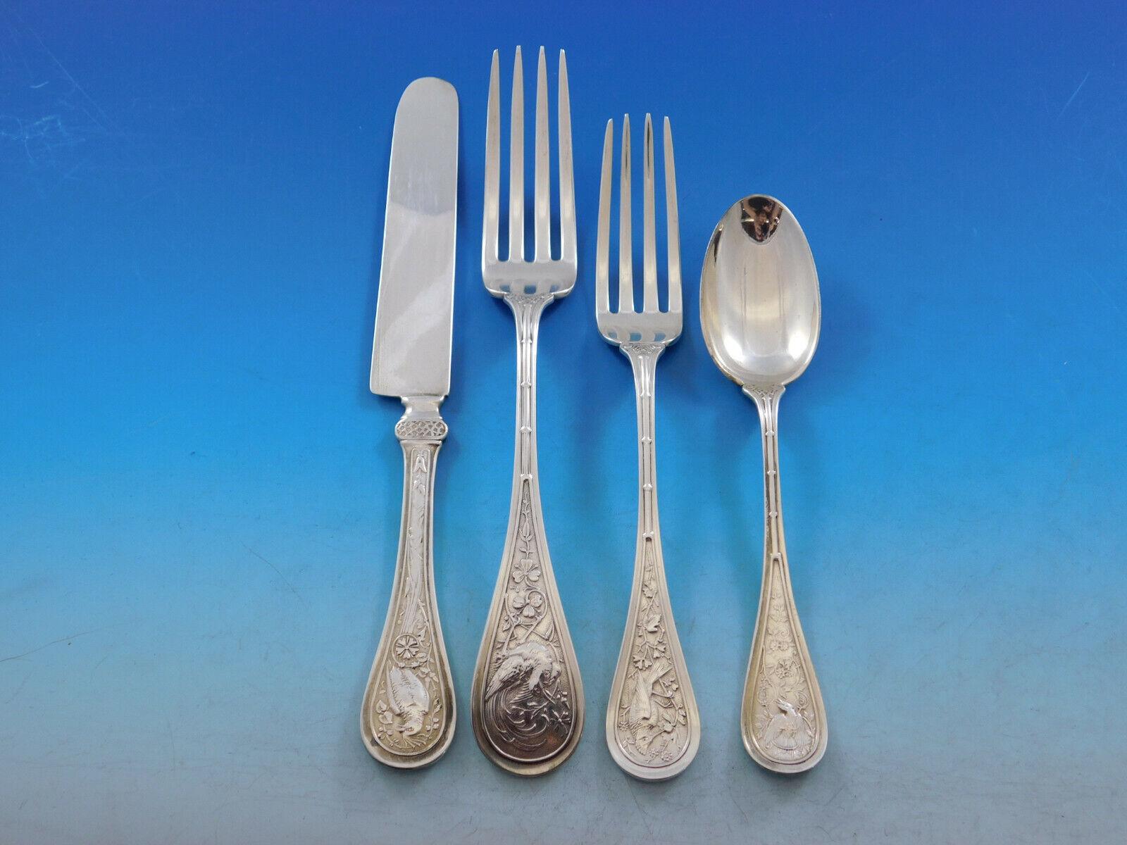 Rare Bird by Wendt, circa 1872, sterling silver Flatware set - 106 pieces. This multi-motif Japonesque pattern has a bamboo design running up the handle, with a swooping or plunging bird amidst assorted flora. This set includes:

8 Knives, flat