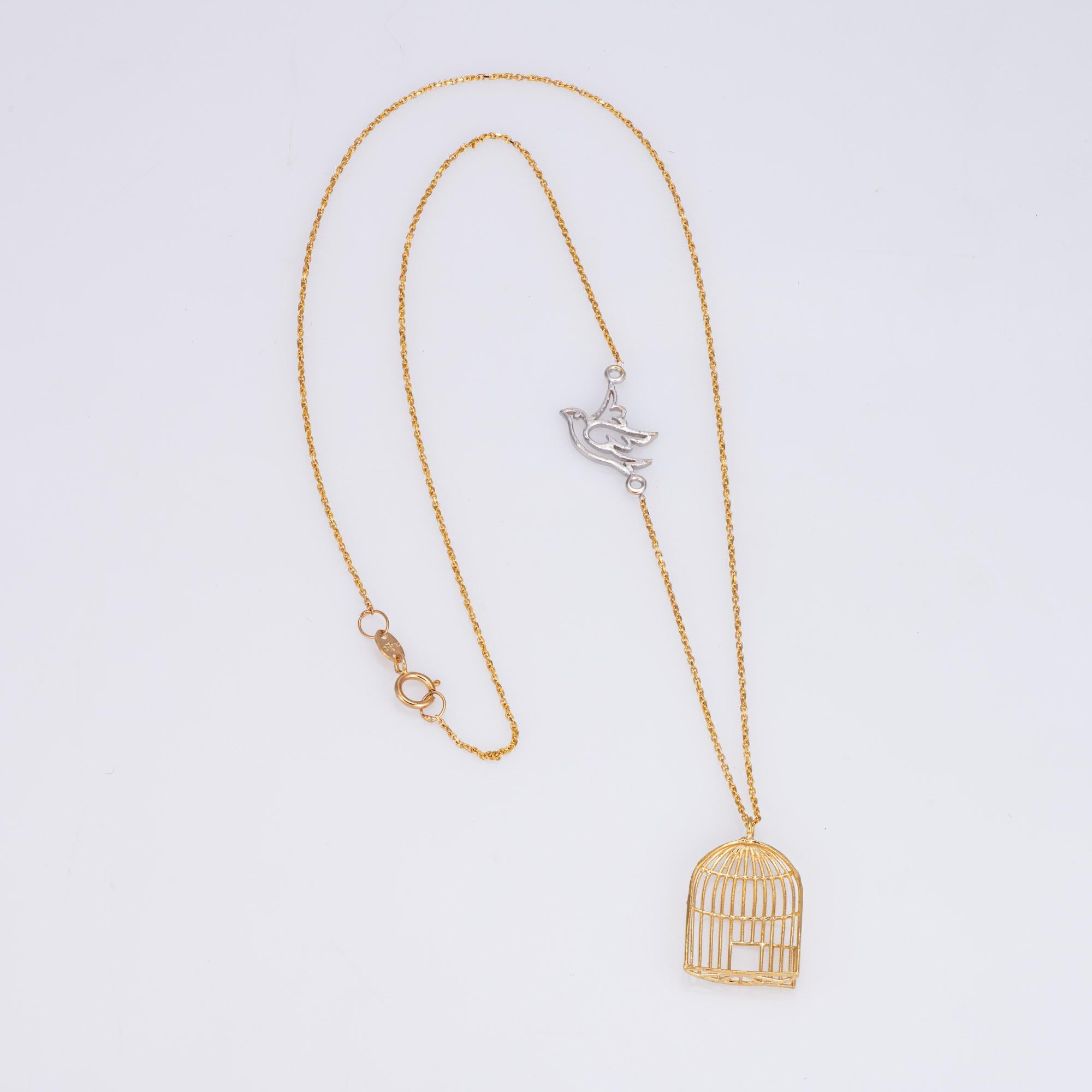 Stylish and finely detailed necklace crafted in 18k yellow gold.  

The symbolic necklace highlights an open birdcage with a white gold bird embedded into the chain, as if flying from the cage. The necklace is great worn alone or layered with your