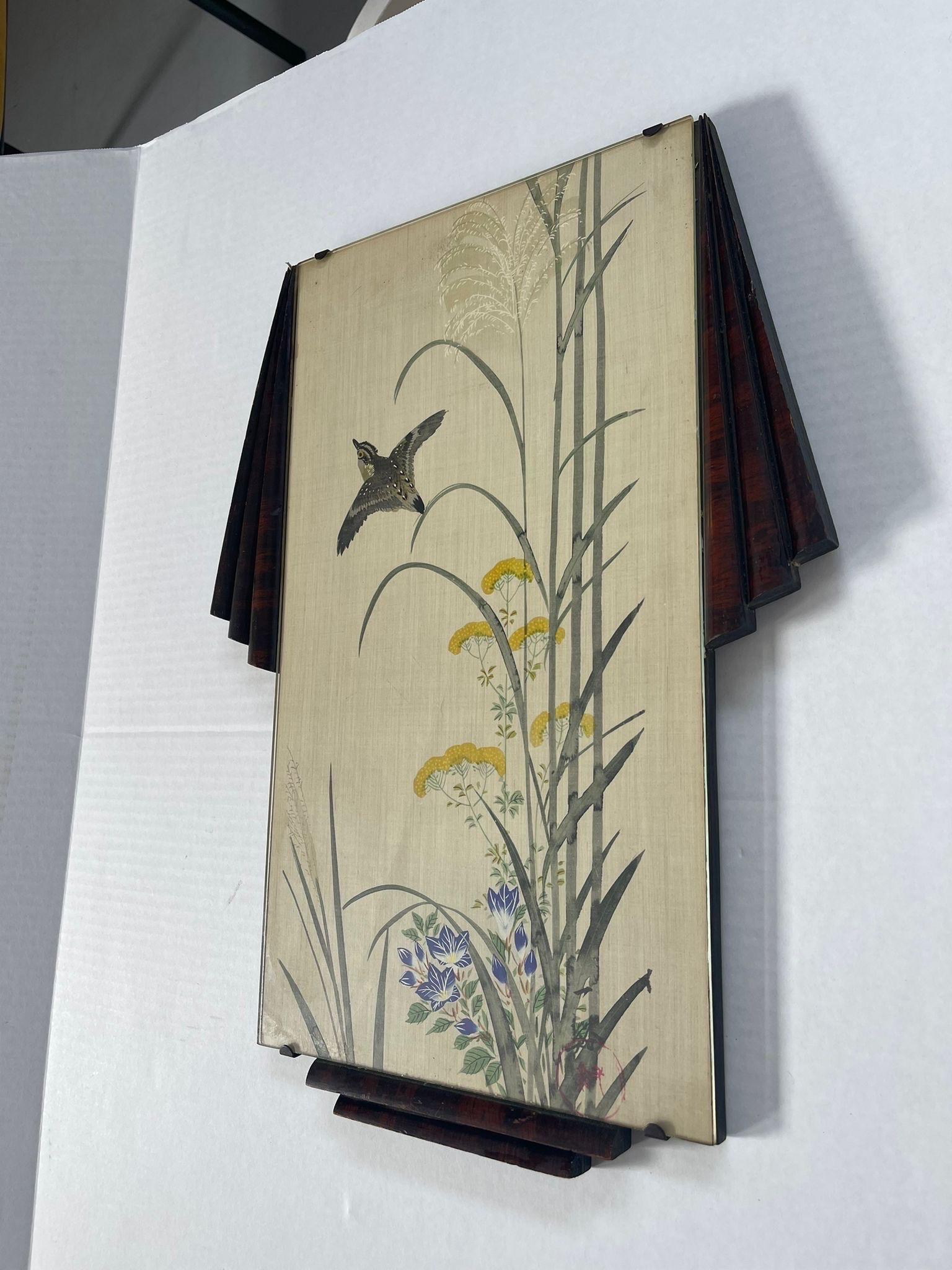 Painting Features Grey Bird Flying Through Yellow and Blue Flowers. Possibly 30s with Vintage Hardware.Tag Reads Painting on Silk. Vintage Condition Consistent with Age.

Dimensions. 13 W ; 1 D ; 18 1/2H
