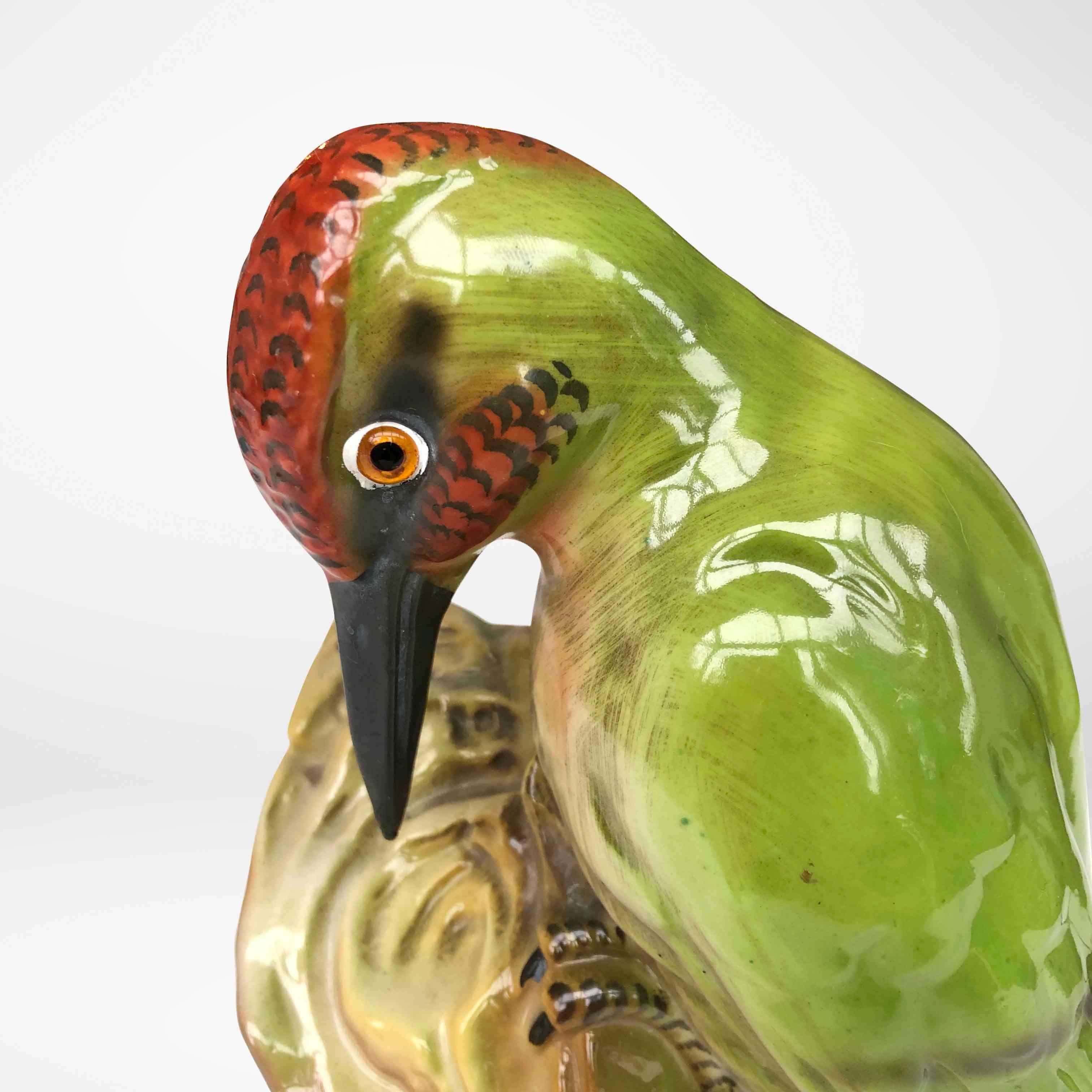 Cute lamp in porcelain of a woodpecker. These lamps were produced in the past in the shape of all kinds of animals and used as a fragrance or perfume lamp to combat the smell of cigarette smoke. The lamp is in perfect condition and has beautiful