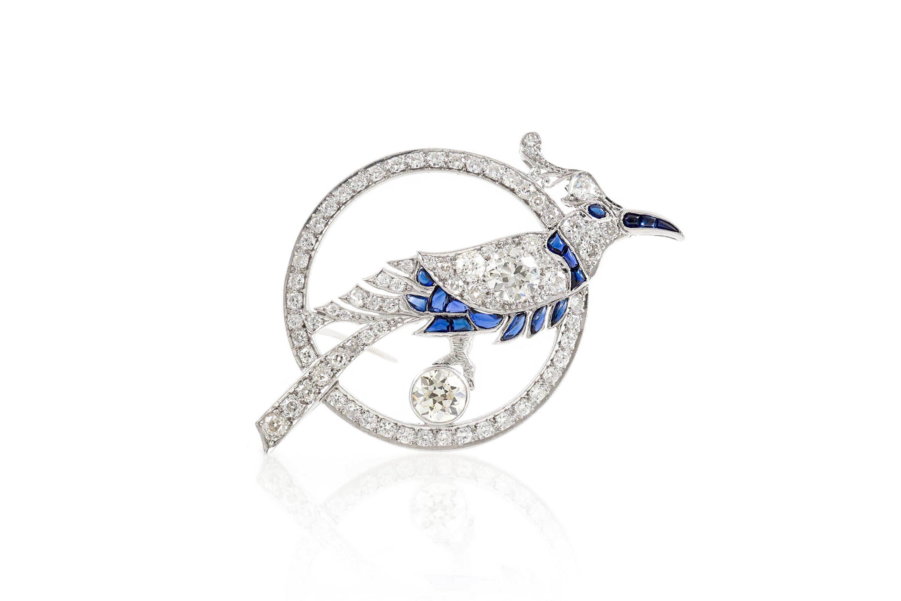 Bird Inside Circle with Sapphire and Diamonds Brooch In Good Condition For Sale In New York, NY
