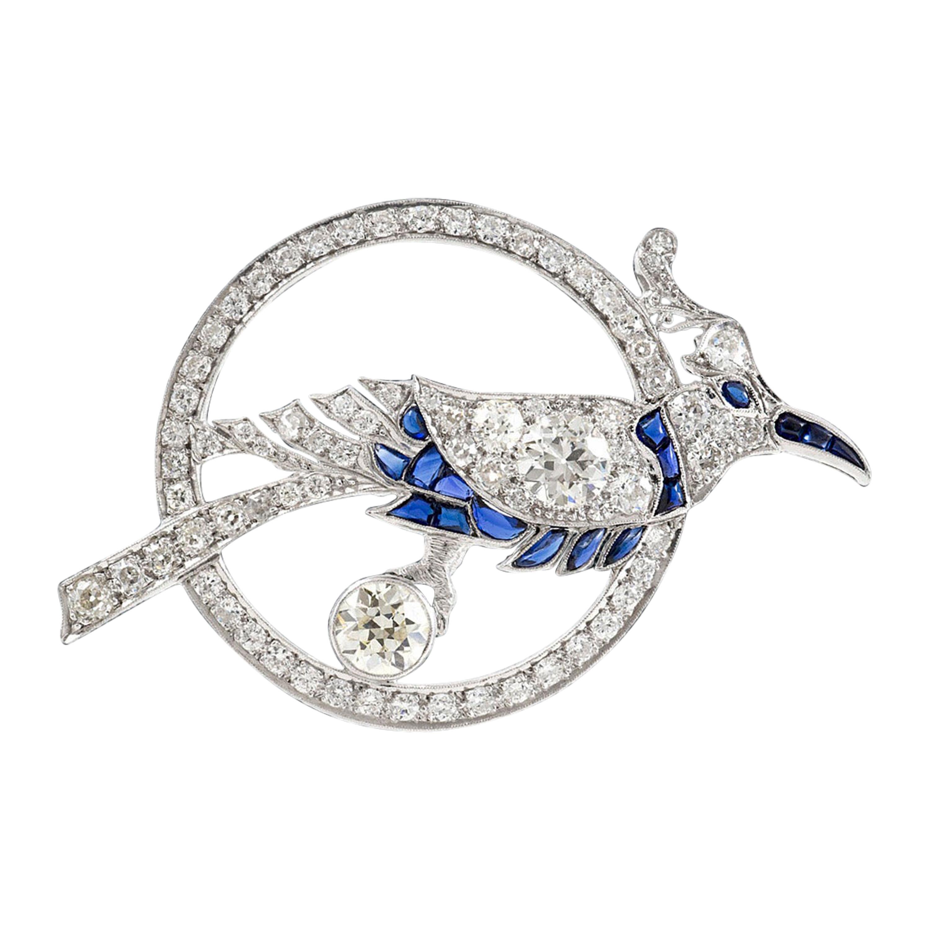 Bird Inside Circle with Sapphire and Diamonds Brooch For Sale