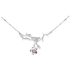 Bird necklace with diamonds and sapphire