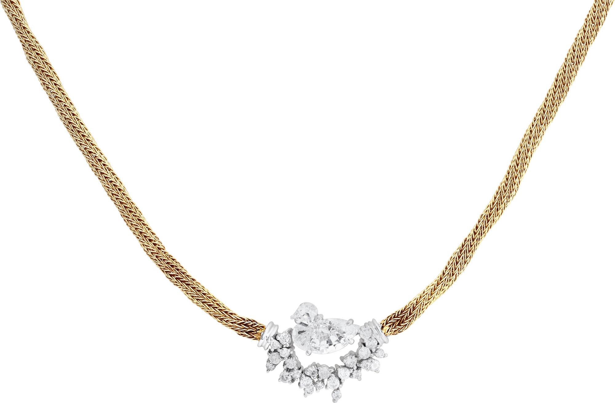 Collier nid d'oiseau en or jaune et blanc 18k avec un diamant taillé en forme d'oiseau unique. Les diamants pèsent environ 1,00 carat. 16 pouces.