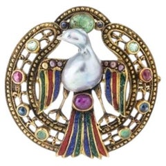 Bird' pendant/pin in 19.2K Gold with enamel.