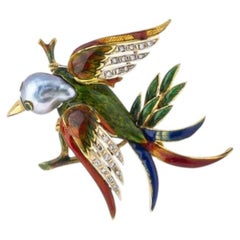 Bird' pin in 19.2K Gold with enamel.