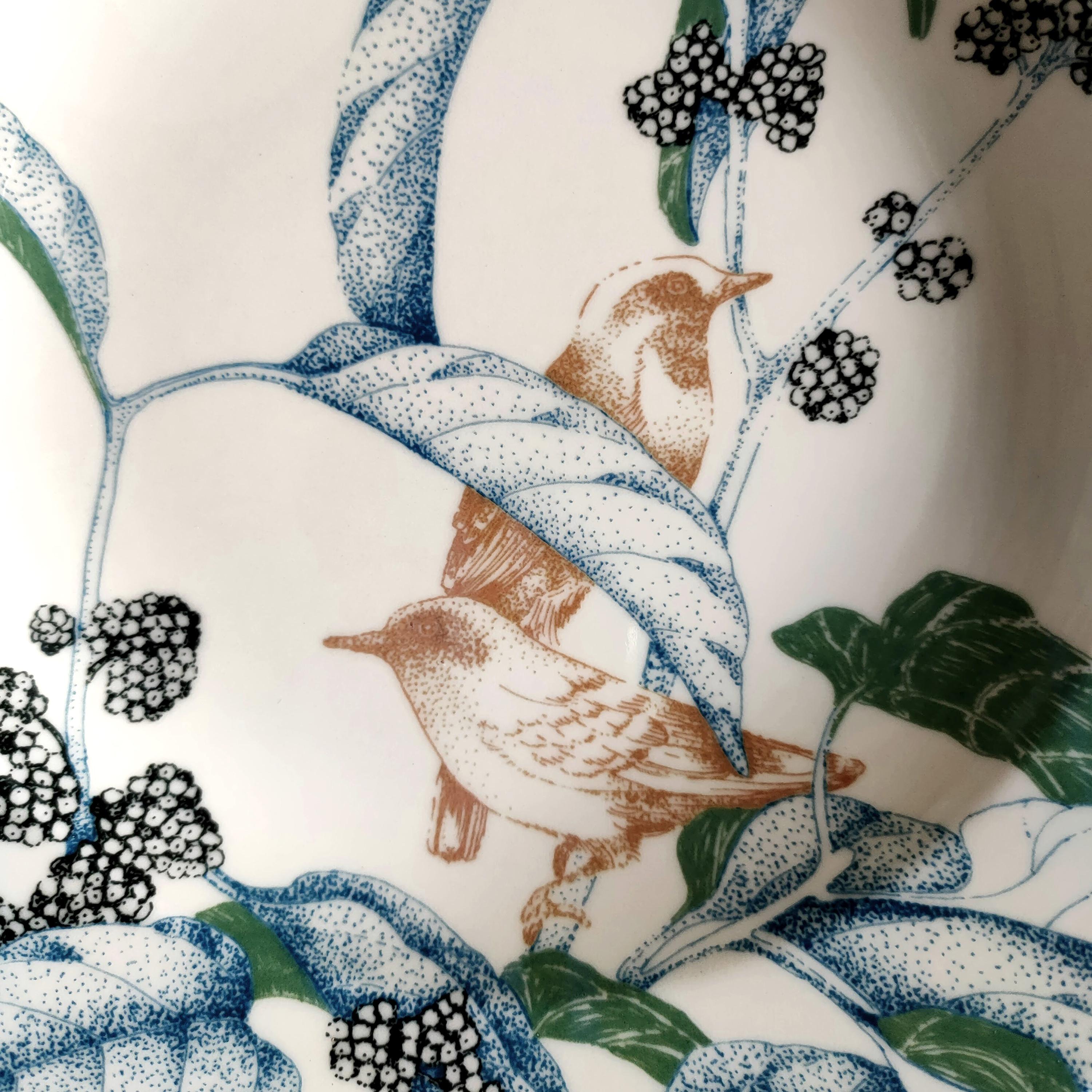 The Bird Song collection, features a design of wild birds hiding among delicate and intricate foliage in soft shades of blue, terracotta and dusty green. Originally created using the 'pointillism' technique, each scene, illustrated in detail,