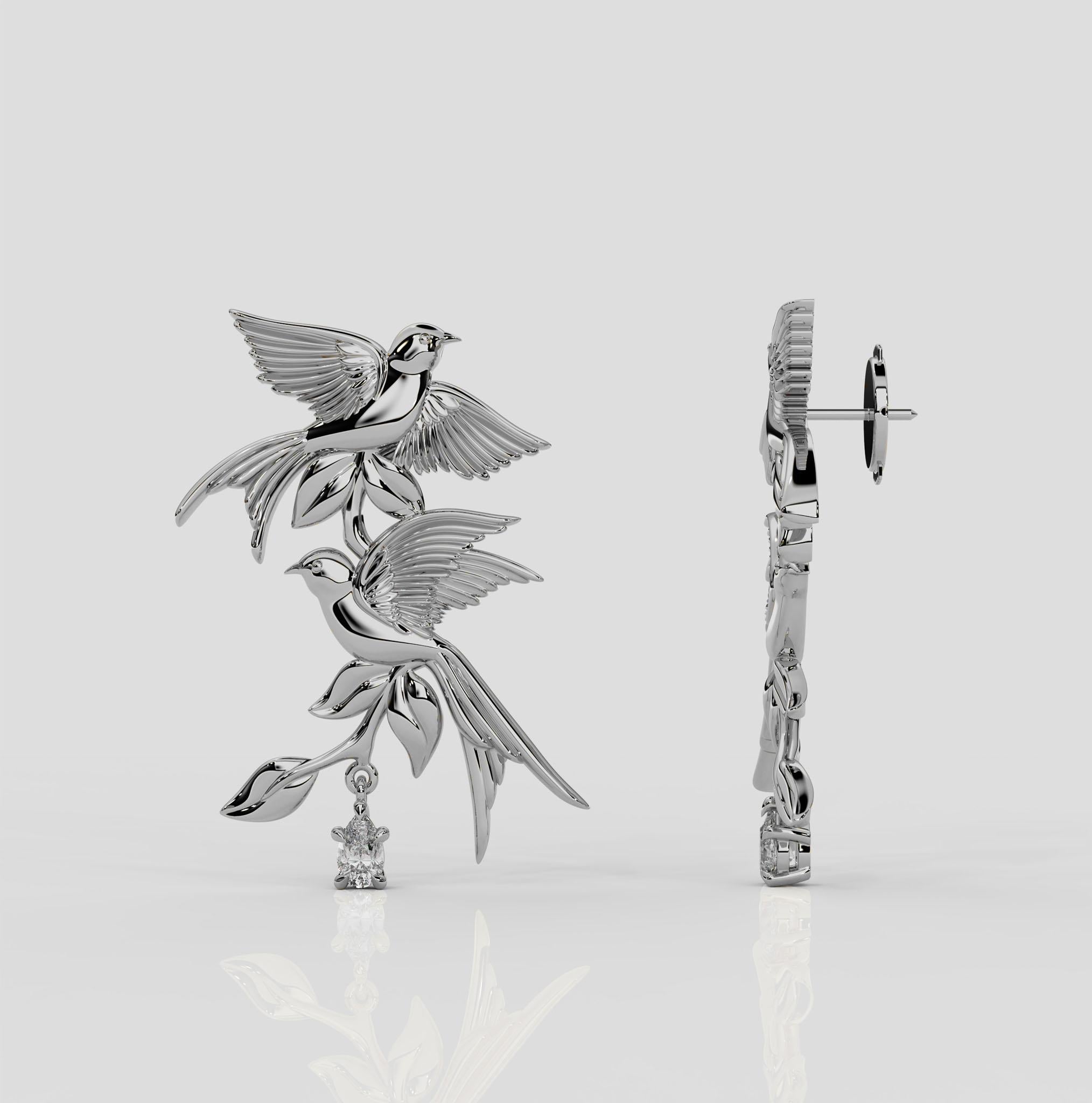 The Bird Song Earrings from Georgina Yvonne's award winning 'Wonderland' Collection. These earrings feature two swallows, and represent the freedom that Wonderland brings. These earrings also feature natural pear diamond drops - adding a hint of