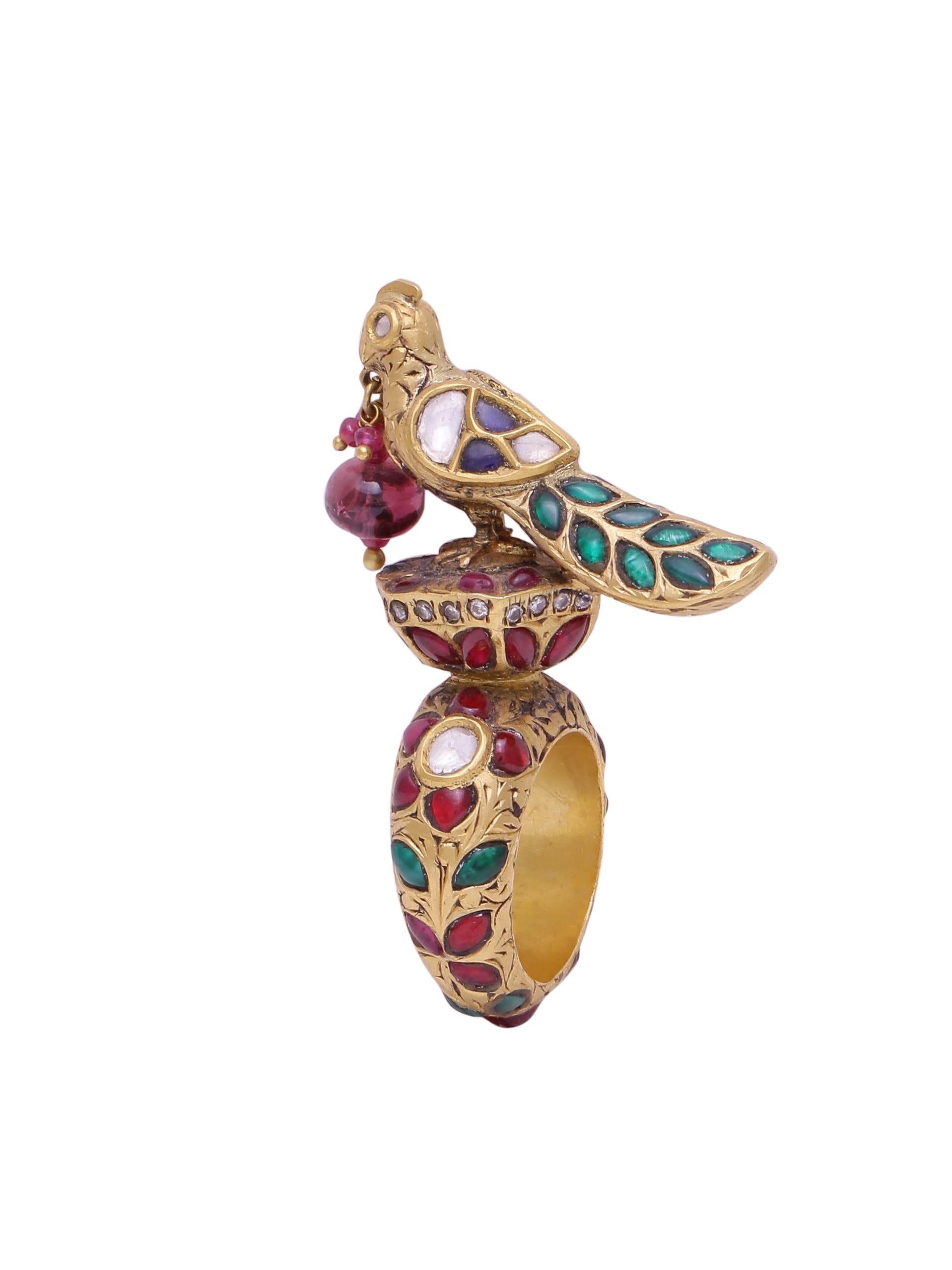 A magnificent Statement ring with a bird covered in diamonds and intricate gold work.
Throughout the ring are gems and diamonds and this very special old Indian work on gold called 