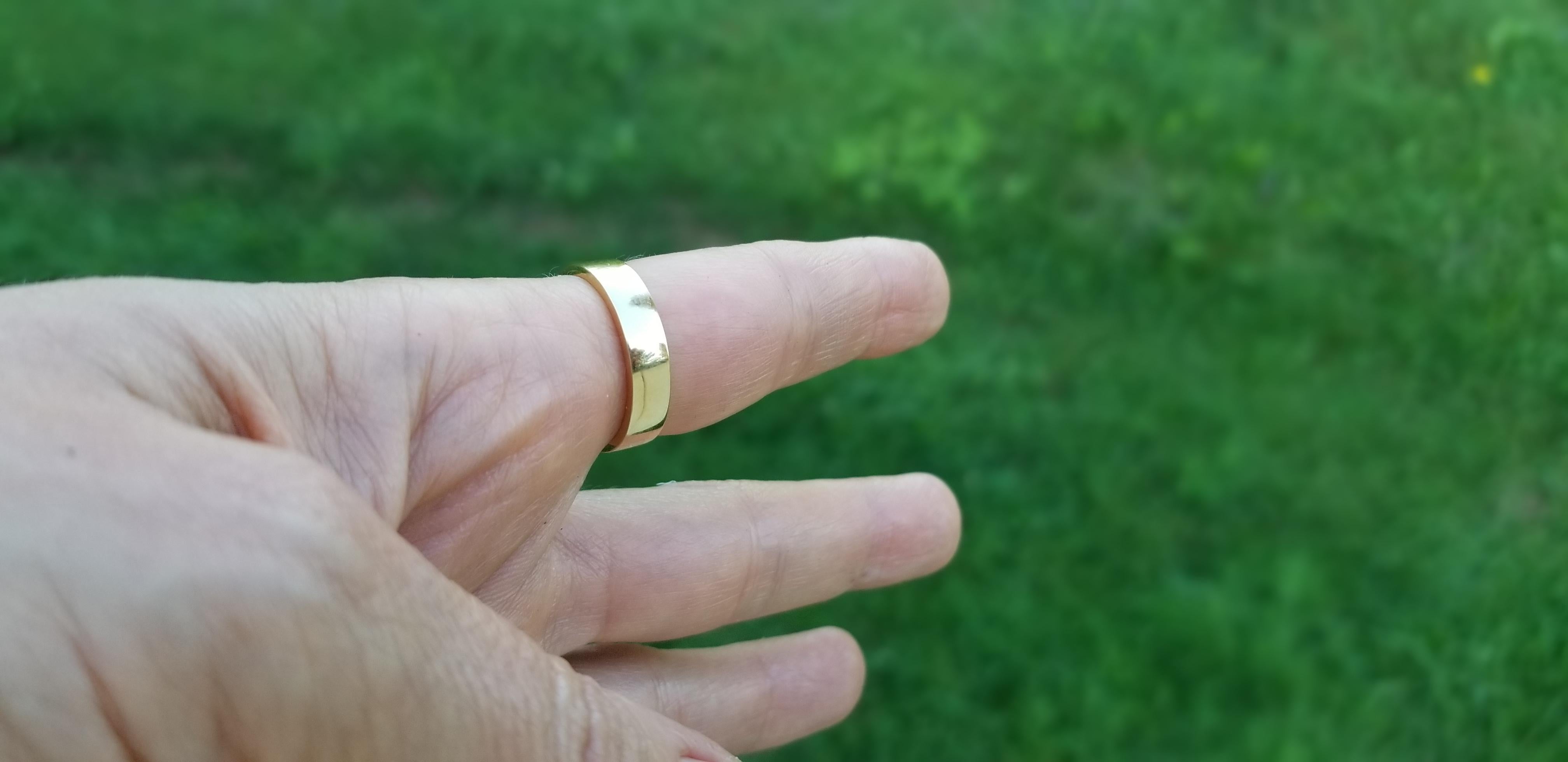 This smooth, solid 18k yellow gold band wraps comfortably around the finger.
It can be worn alone as a statement piece, or stacked together with other rings.
This ring was designed by Manya & Roumen in New York, and has never been worn.