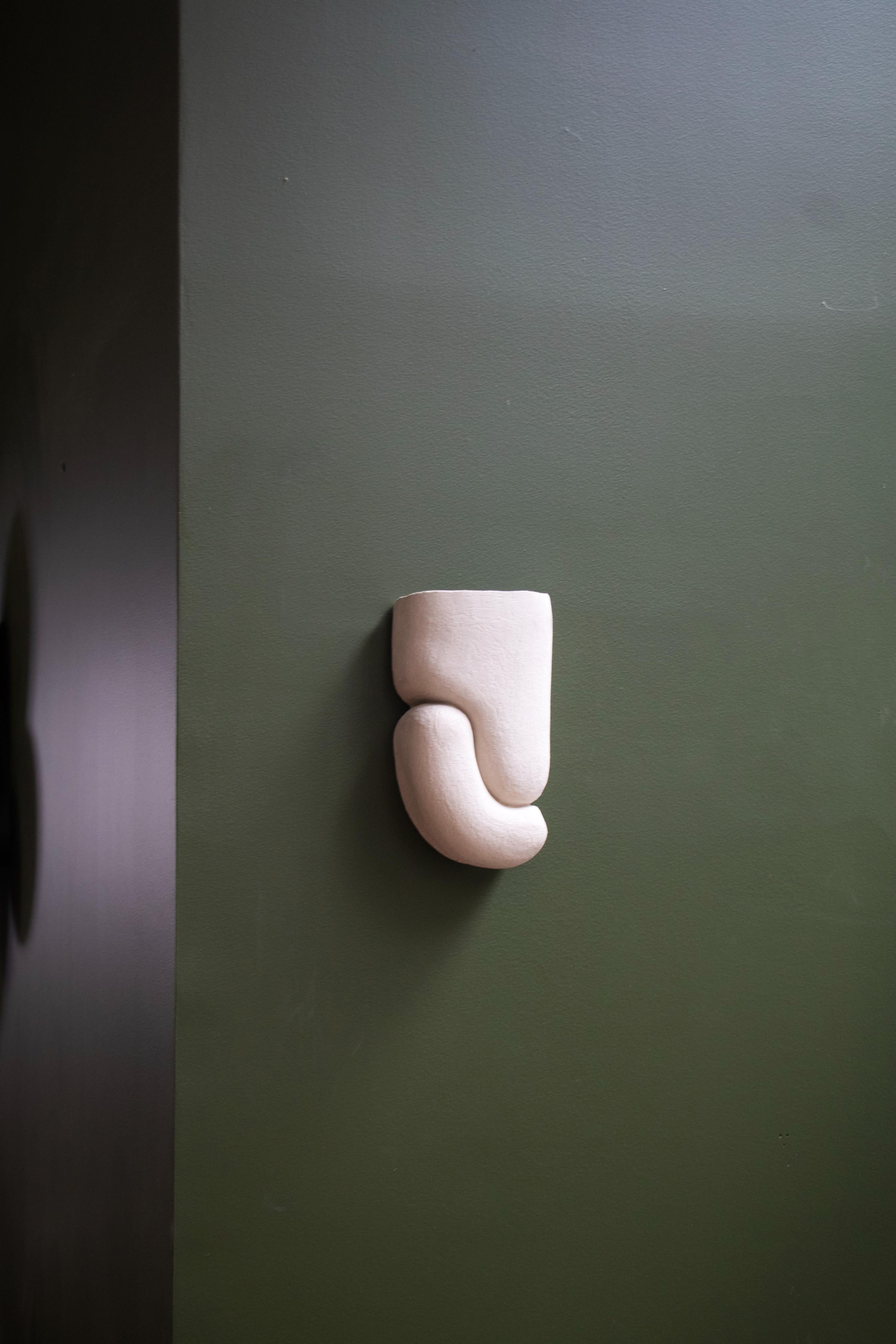 Bird Lamp by Alice Lahana Studio
Dimensions: W 13 x D 8 x H 24 cm
Materials: Stoneware

E14 LED bulb, 400 lumens, 4W, warm white 2700k, T26 Filament Tube 4W, dimmable (not included)

Handmade in our workshops, Bird is a wall lamp in chamotte
