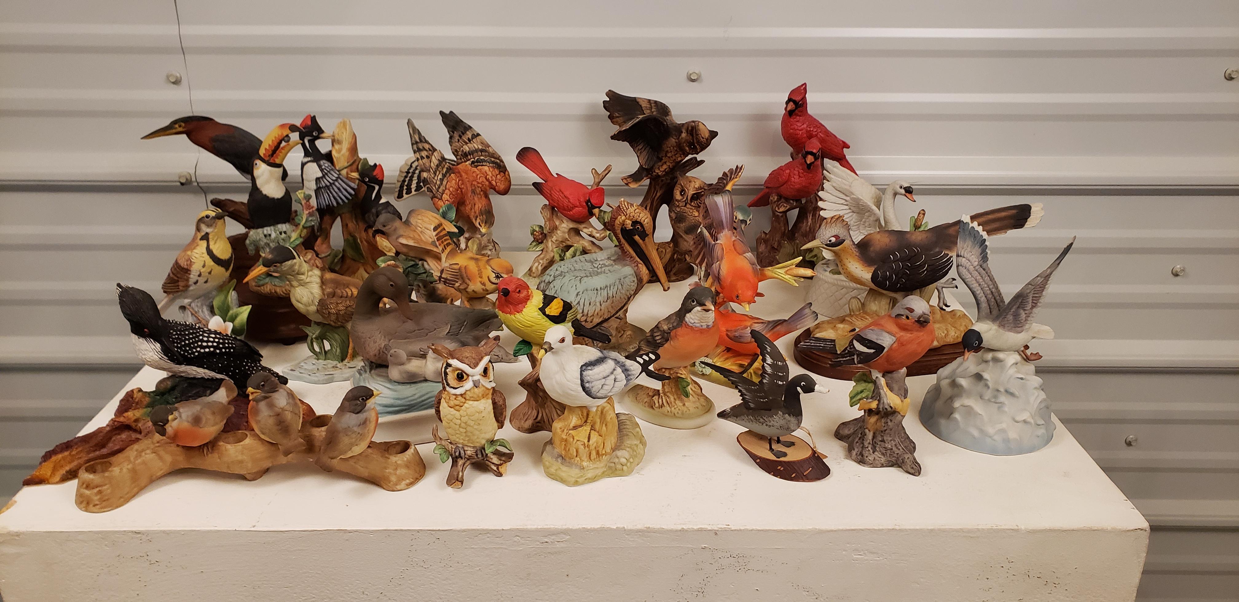 A lifetime collection of birds. A set of 25 some made of porcelain some carved from wood or resin. Of the 25 of them 5 are music boxes. 
 I actually think it's quite charming.
 Sizes vary but the price includes all 25 pieces.