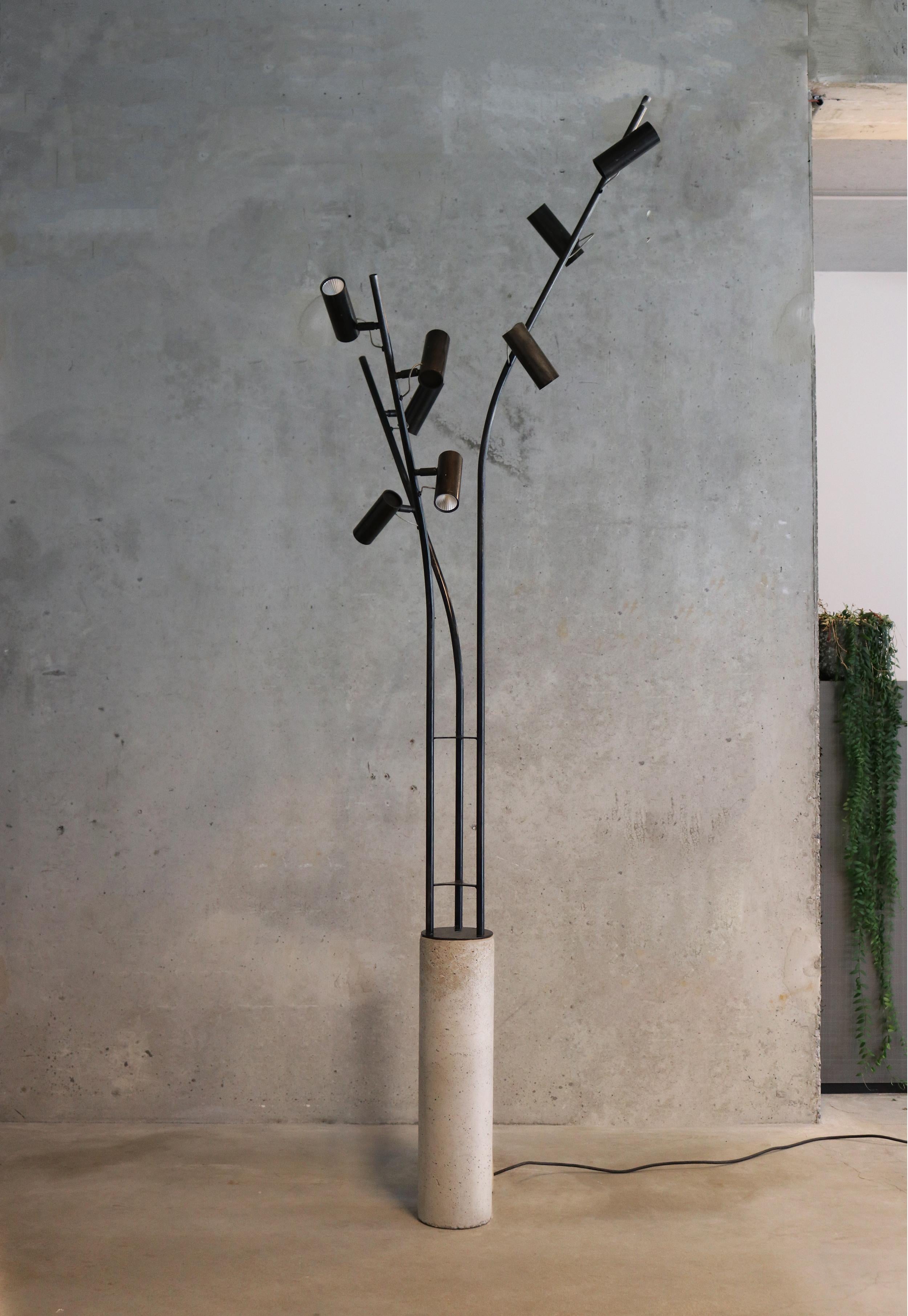 Design Lungoo

Concrete base / pedestal / dimensions 60cmheight, diameter 15cm
3 blanc steel or iron tubes chemically blackened / 180 length, 3 lamps – 135 length , 3 lamps – 135 length, 2 lamps

Total 8 dimmable, directional spotlights, 2 circuits,