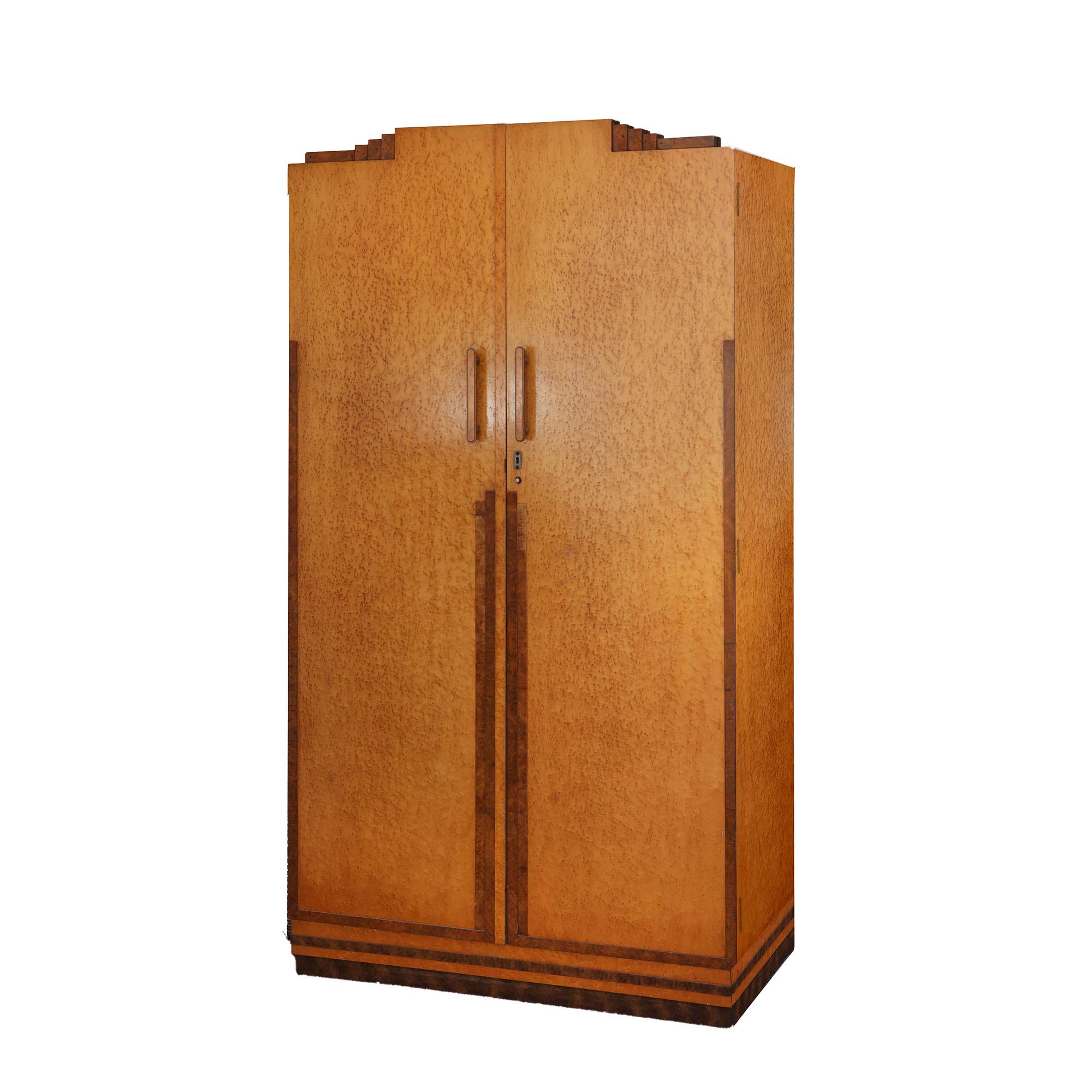 A fine set of midcentury Art Deco bedroom pieces including a large three-door wardrobe with internal hanging and shelves, a 2 door cabinet and dressing table with its original stool. 

All veneered in the finest bird's-eye maple

Wardrobe 1 H