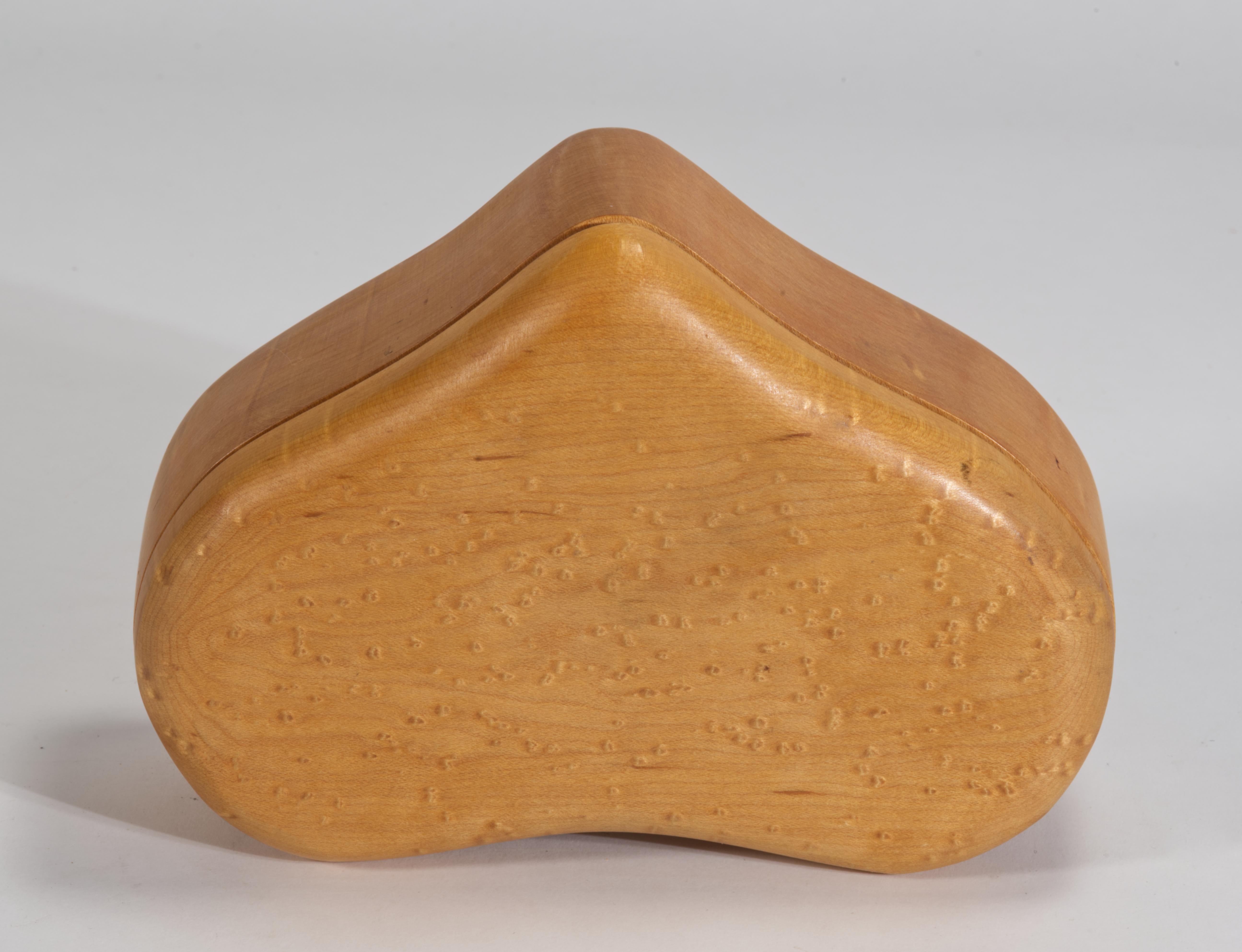  Vintage large decorative box with sliding lid features handcrafted heart shaped form, carved of solid Birds Eye Maple wood. The fine wood texture is emphasized by the semi-matte tung oil and wax finish. The color ranges from light, buttery shades