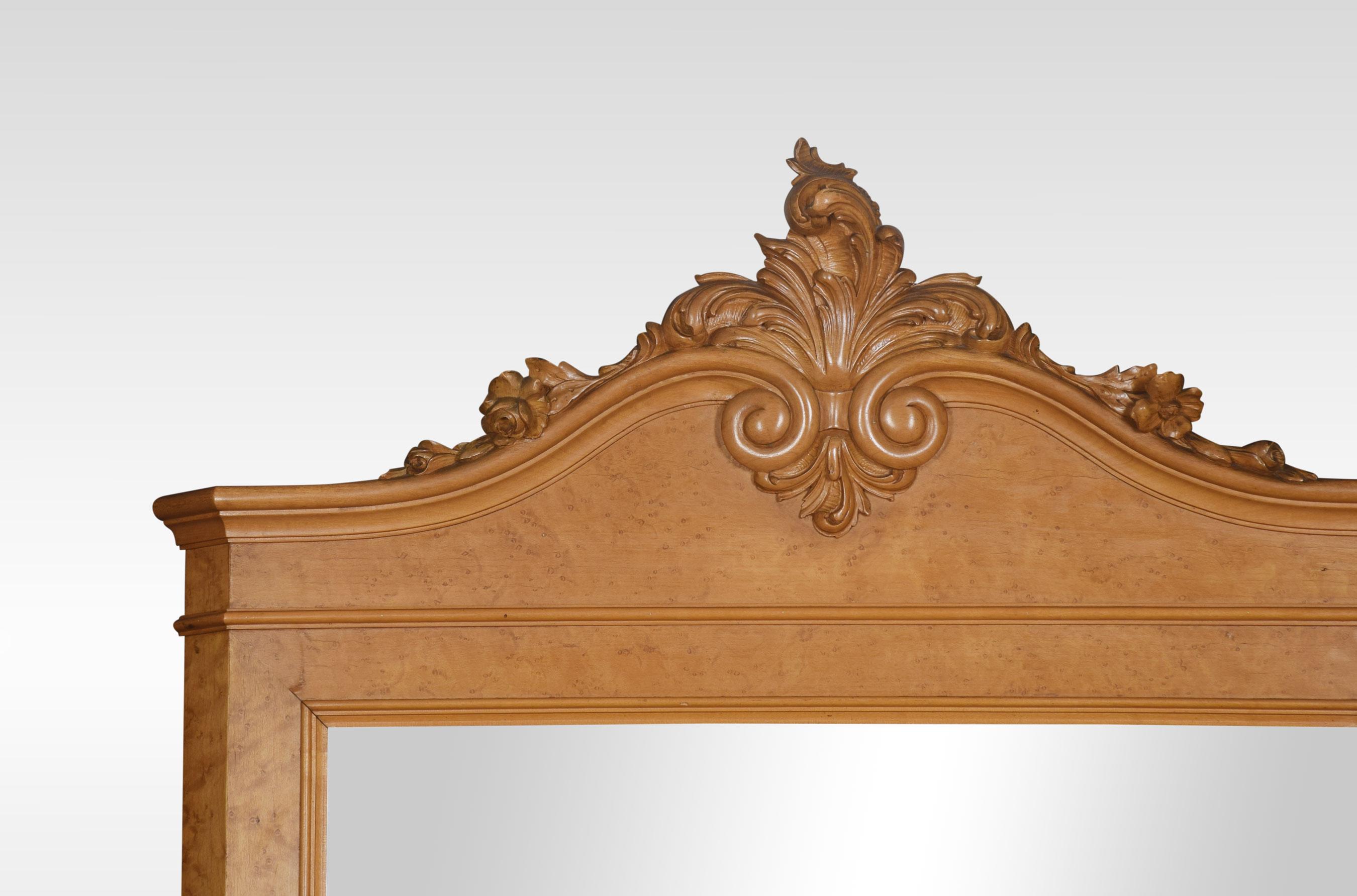 Birdseye maple chest of drawers with mirror back having carved scroll pediment above large rectangular mirror encased in a maple frame. The chest with unusual marble top above four graduated drawers fitted with well-casted brass handles all raised