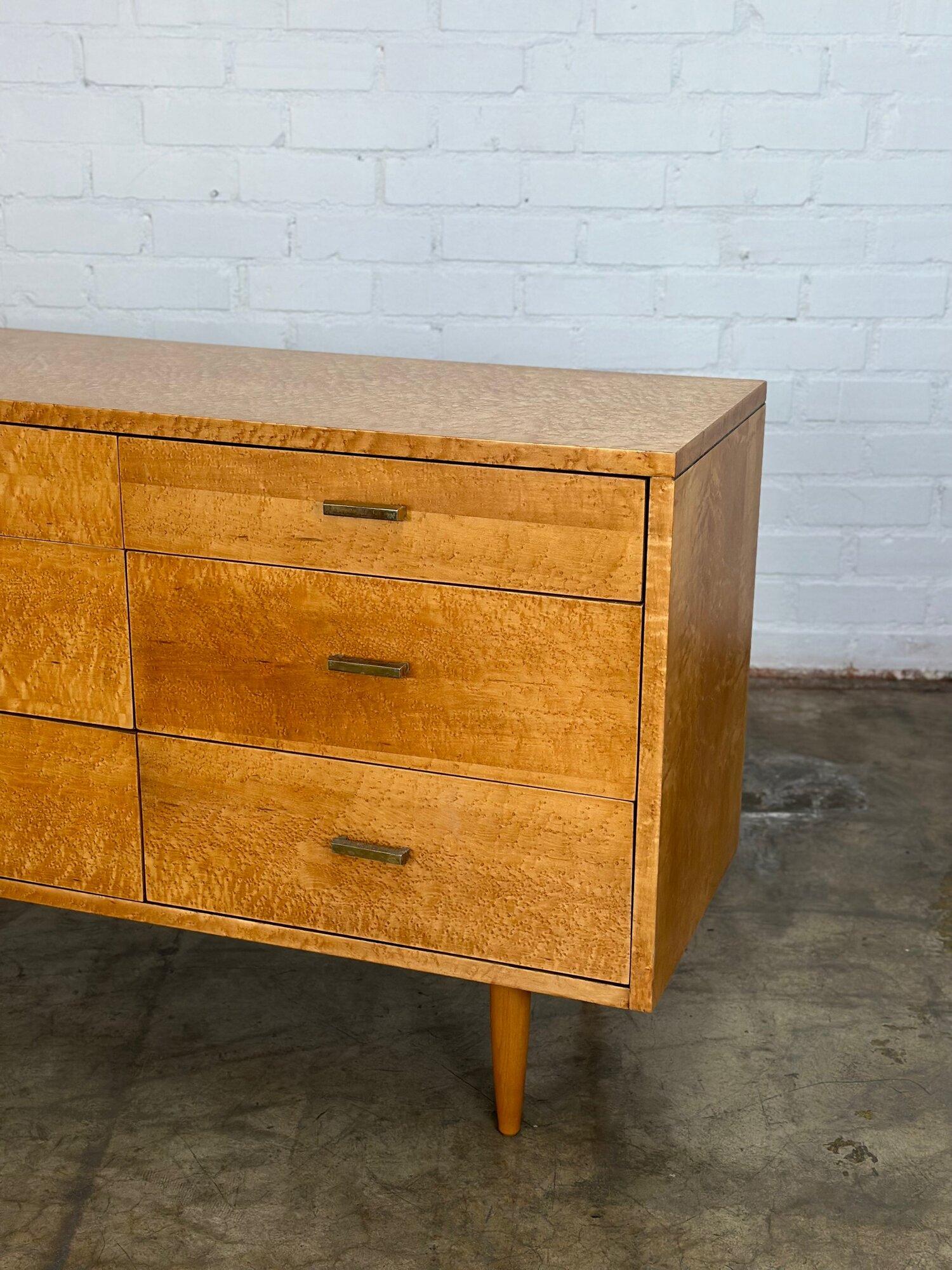 W72 D18 H33.5

Fully restored triple dresser on solid tapered legs. Item featured original hardware and has original manufacture stamp in tact. Dresser is fully functional and structurally sound. 

