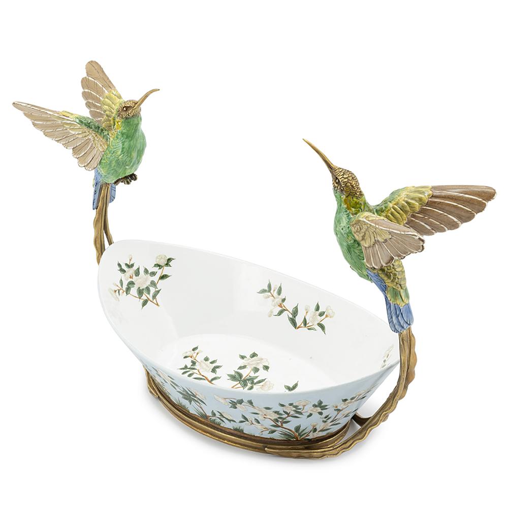 Bowls birds Porcelain hand-painted in white
porcelain with a bronze frame. With 2 birds
in porcelain, hand-painted and with bronze 
head and beak.