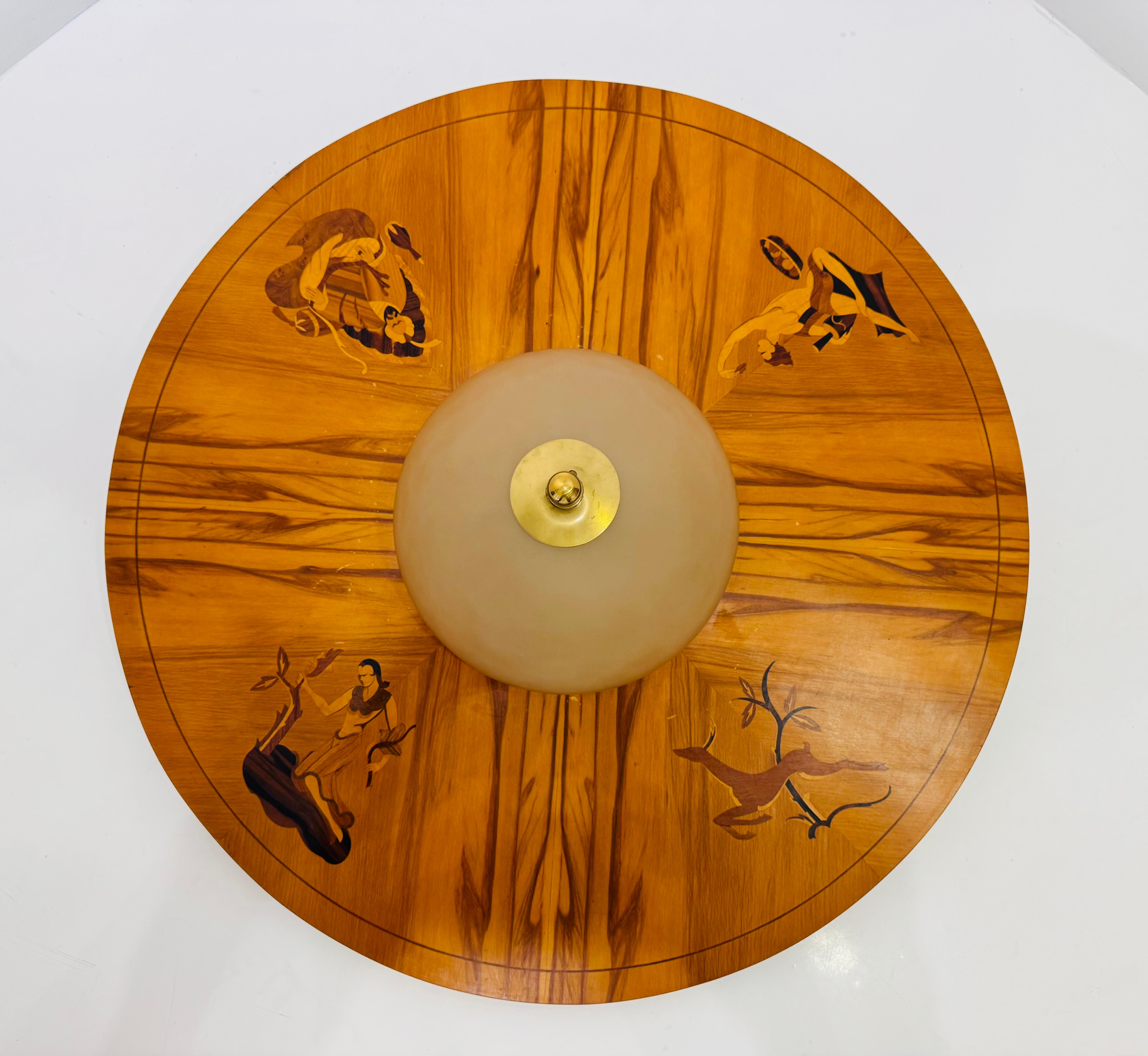 A wonderful large 1920 Swedish Grace marquetry wood designed flush ceiling lamp with light fisted custard glass half dome shade by Birger Ekman for Mjolby. Three standard sockets. Rewired. 