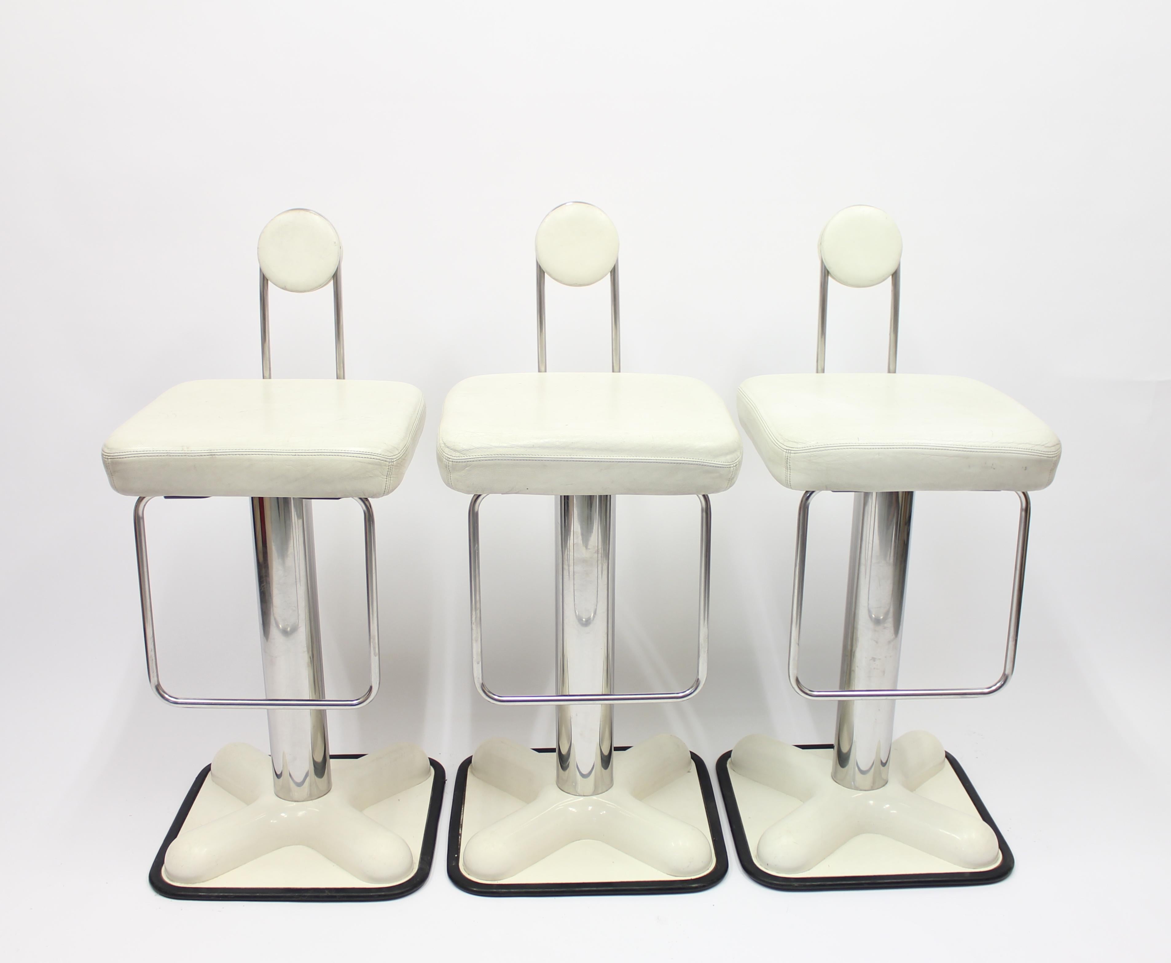 Set of 3 Birillo bar stools designed by Joe Colombo in 1971 for Italian manufacturer Zanotta. These examples are from the 1970s. White leather seat and back on a chrome and metal/plastic base. Leather and bases with patina from usage over the years.