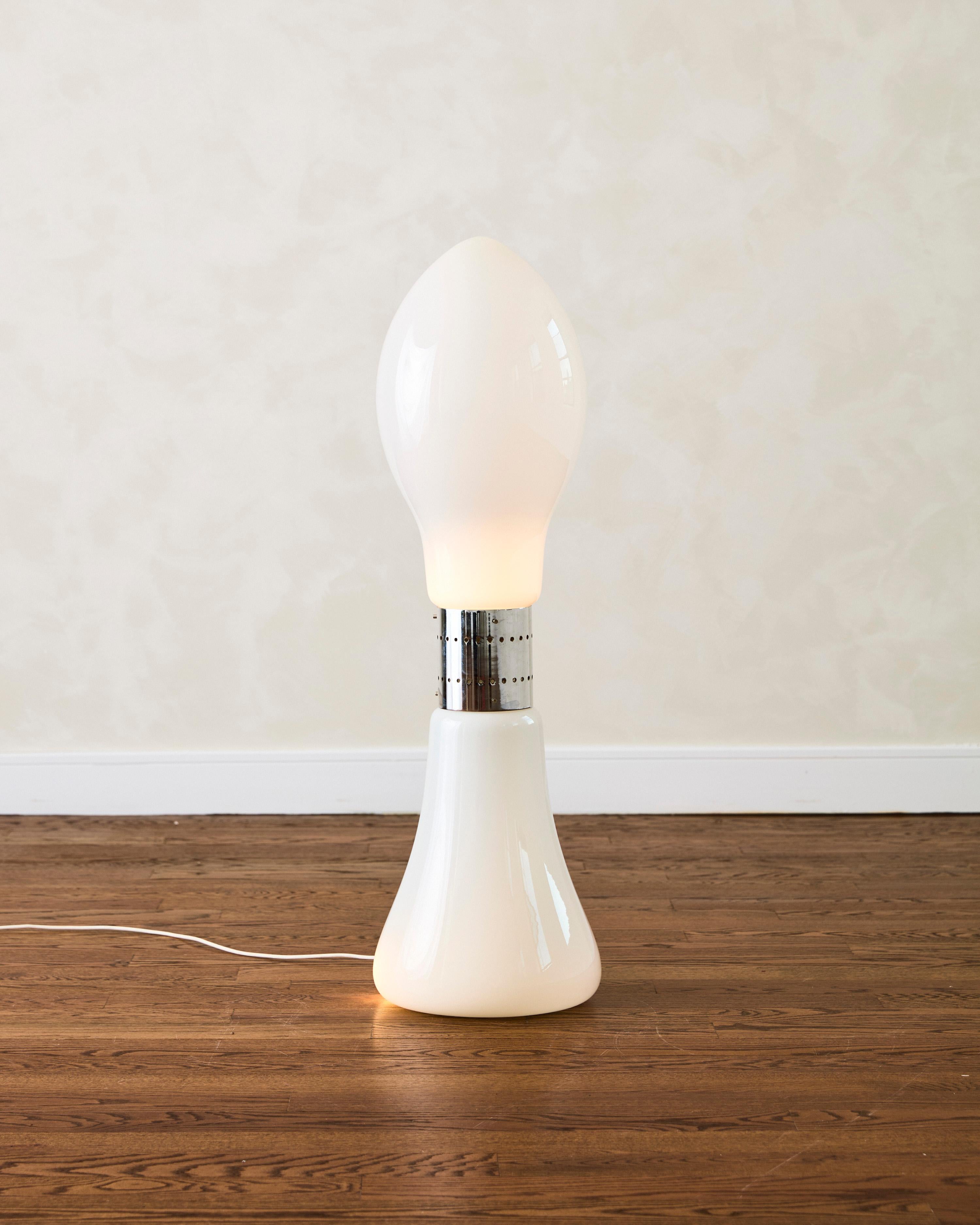Birillo floor lamp, designed by Carlo Nason for Mazzega featuring opaline Murano glass, the lamp consists of two separate sections resembling a lipstick, connected by a chrome metal band. Each section is illuminated by an E27 light fitting.

