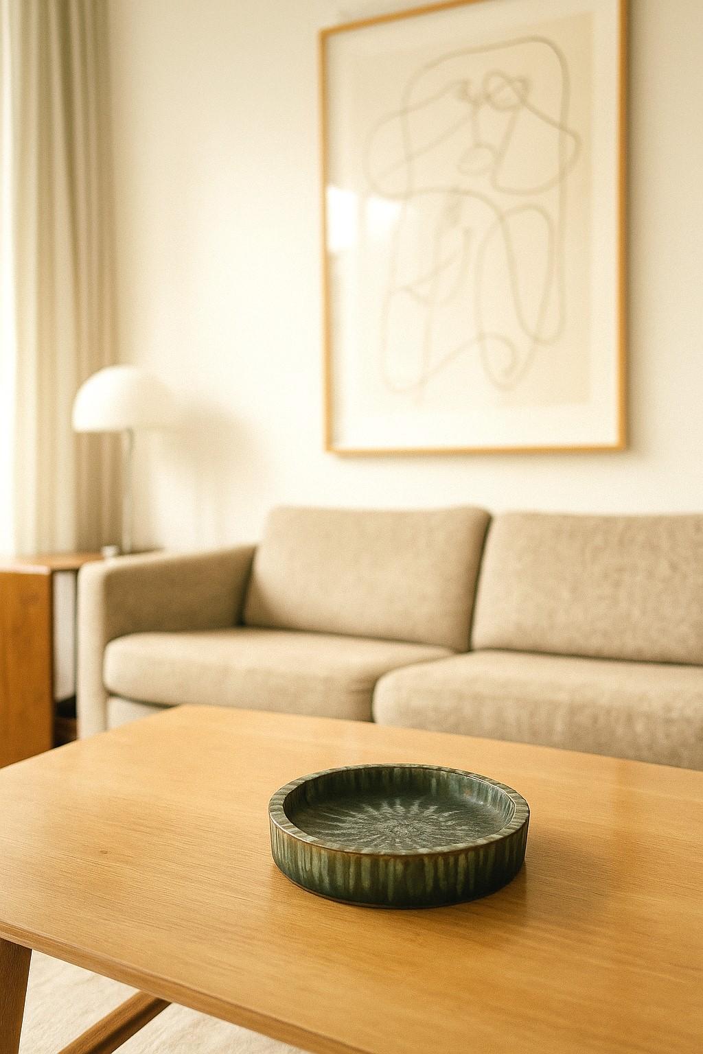 A small signed plate or bowl designed by the prestigious and well known artist /designer Gunnar Nylund, one of the most prominent modernists in Scandinavia. This is plate from the series known as the Sintra, from the 60s with a fantastic geometric