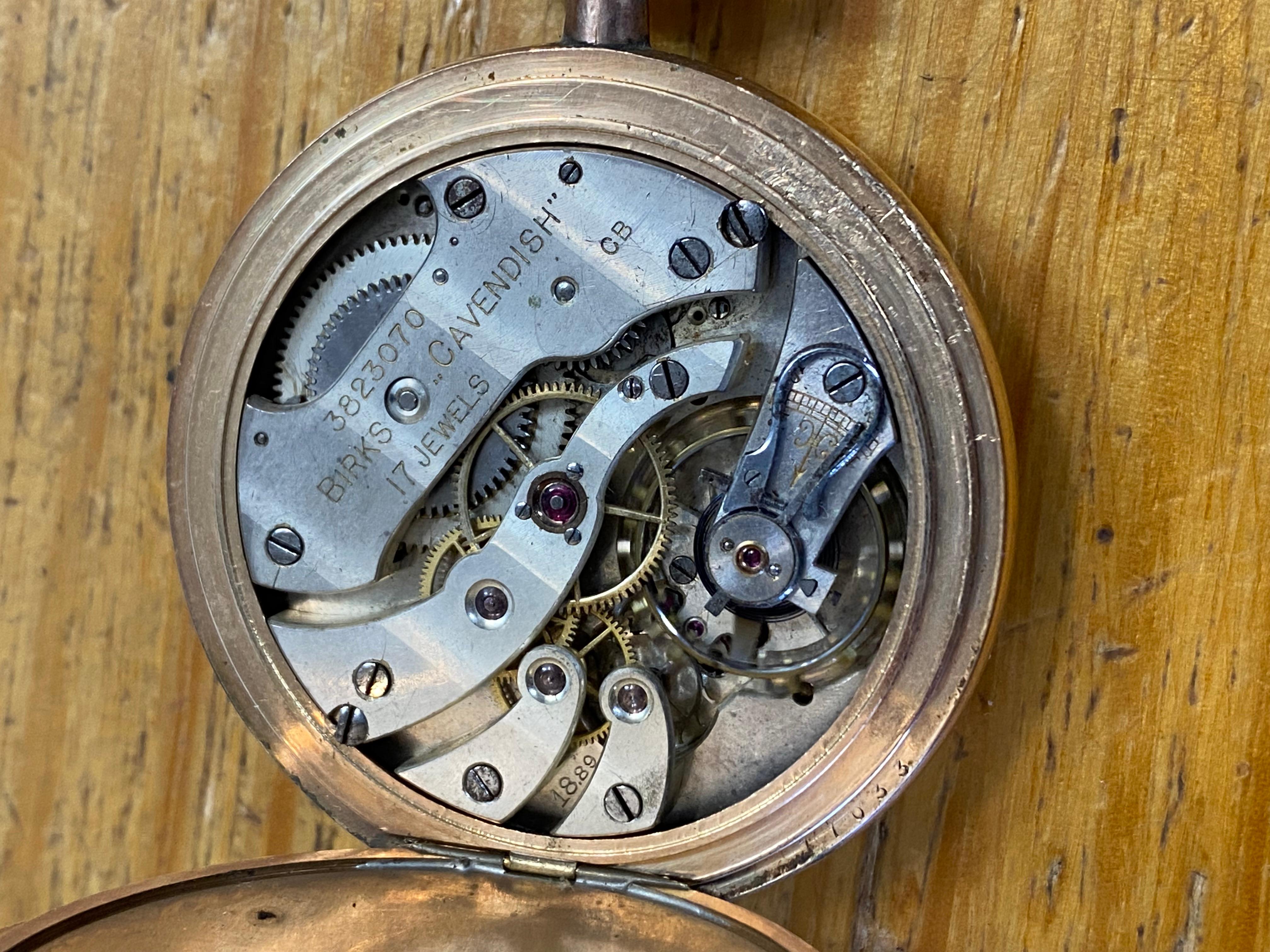 This pocket watch by Birks “Cavendish” 
dates back to 1920’s 

Despite its age, 
its in a great vintage condition & in excellent working order 

Designed as an Open Face, 
the piece is centering a white porcelain dial, 
adorned with hand-painted