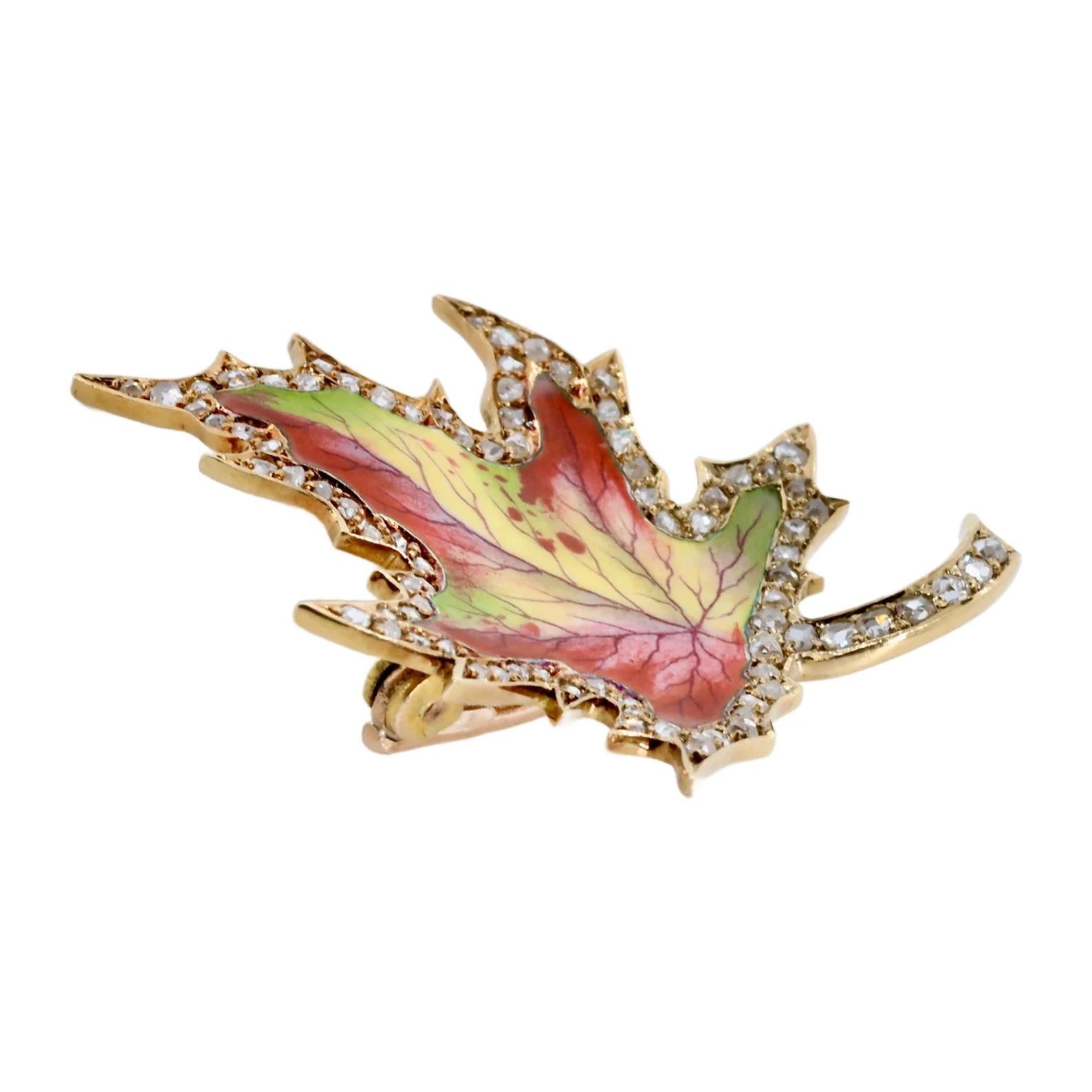 A beautifully enameled victorian period maple leaf brooch by Birks of Canada. Embellished with rich enamel depicting a wonderfully lifelike Canadian maple leaf in shades of red, green, yellow, and even purple. Framed by a border of pave set rose cut