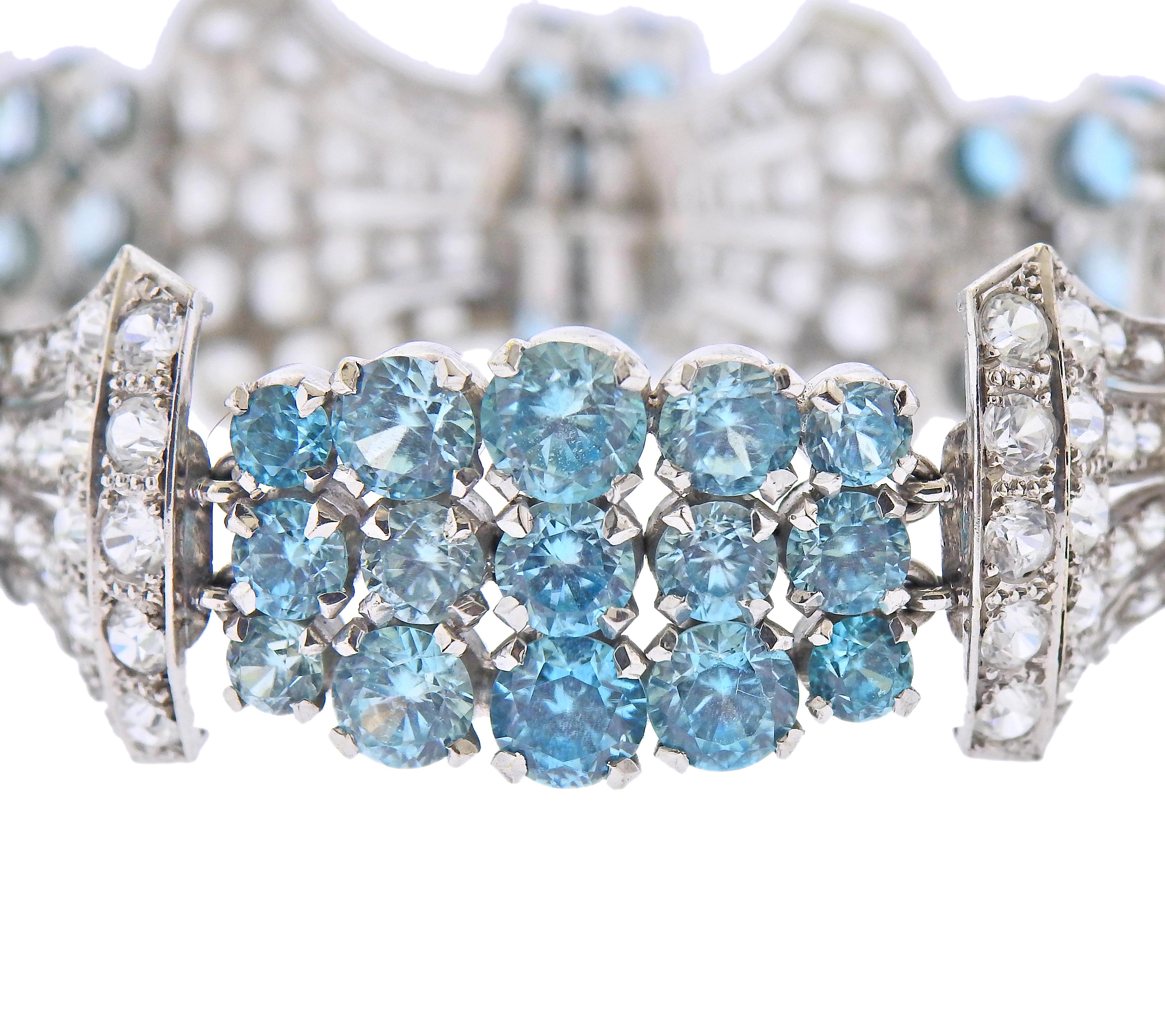 White Zircon and Blue Zircon Canadian-made by Birks, 9k white gold bracelet with blue gemstones and approx. 6 carats in white sapphires . Bracelet is 6.75