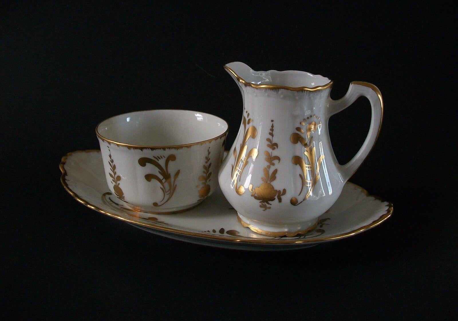 BIRKS (Retailer) LIMOGES (Manufacturer) - Vintage hand painted gilt porcelain cream & sugar with tray - Louis XIV style pattern with embossed pattern/design - each piece with Birks back stamp logo on the base - France - mid 20th
