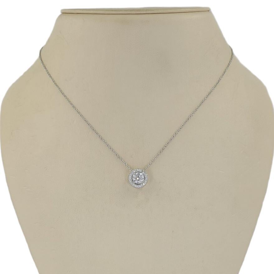 Birks & Mayors Platinum Halo Pendant Necklace Featuring A Prong-Set Round Brilliant Cut Diamond Of VS Clarity & H Color Weighing Approximately 0.50 Carat, Surrounded By 24 Round Brilliant Cut Diamonds Totaling An Additional Estimated 0.25 Carats.