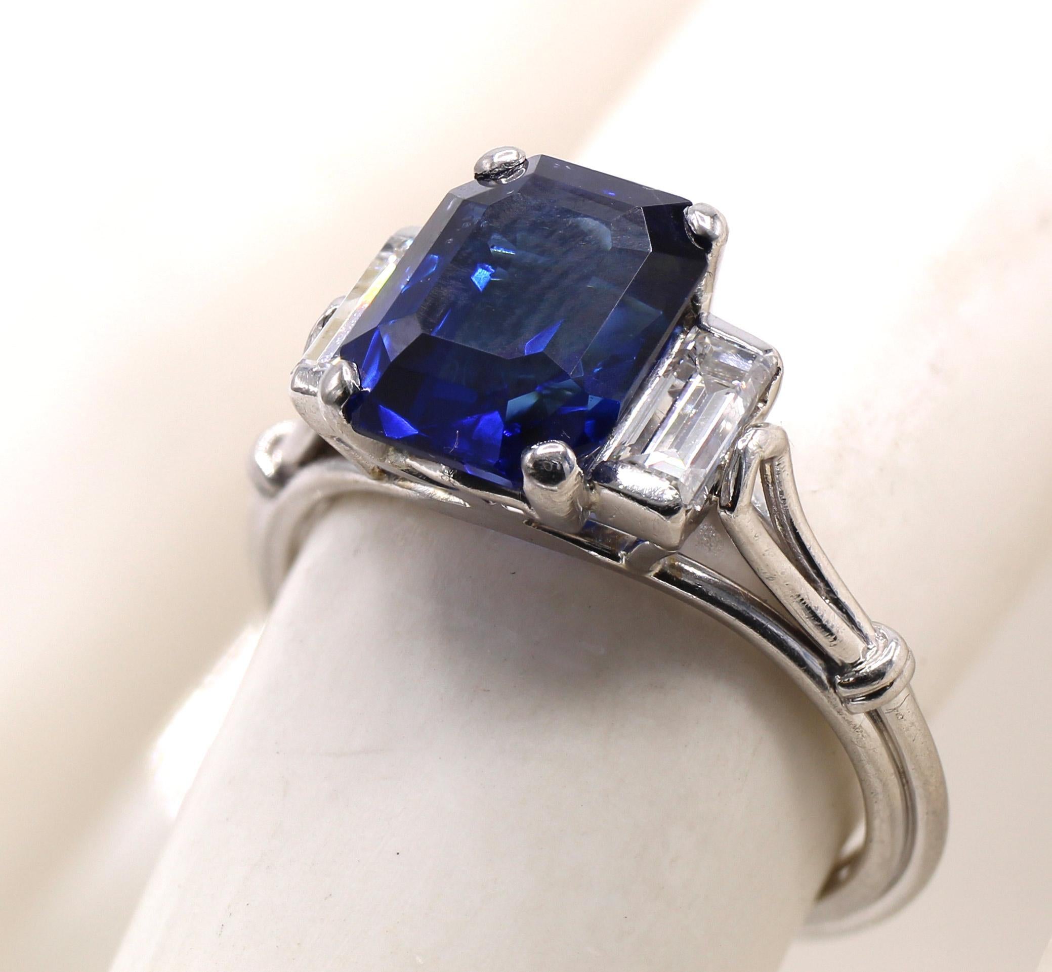Art Deco Burma sapphire diamond ring by Henry Birks & Sons ca 1930. The center piece of this masterfully hand crafted ring is a perfectly cut rectangular step cut Burma sapphire weighing 3.20 carats accompanied by a certificate from AGL - American