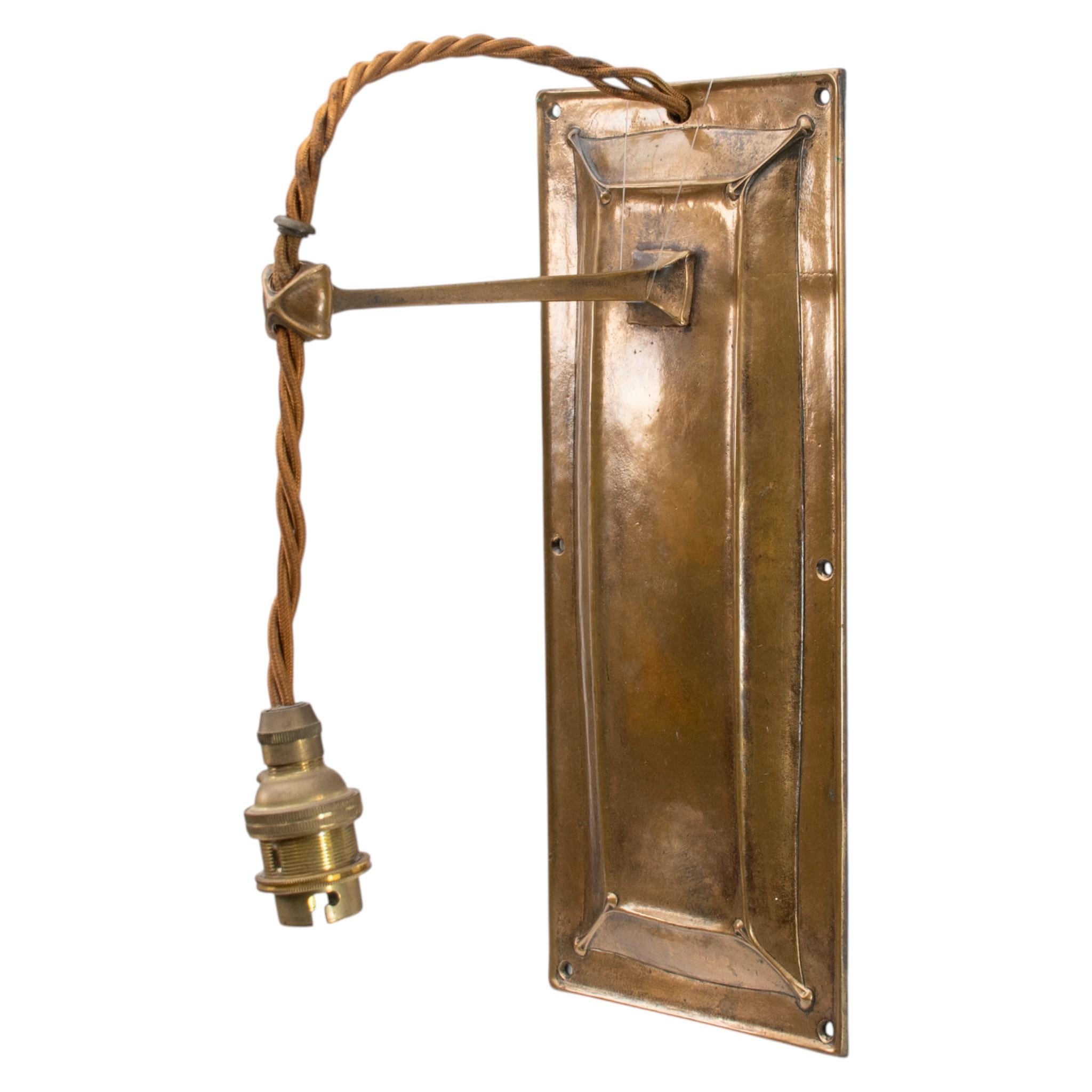 Arts and Crafts Birmingham Guild of Handicraft. A pair of Arts & Crafts bronze wall lights For Sale