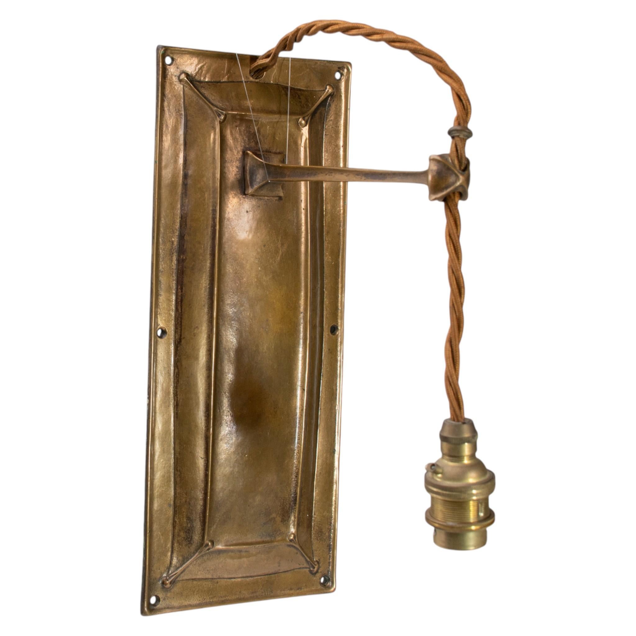 Hand-Crafted Birmingham Guild of Handicraft. A pair of Arts & Crafts bronze wall lights For Sale