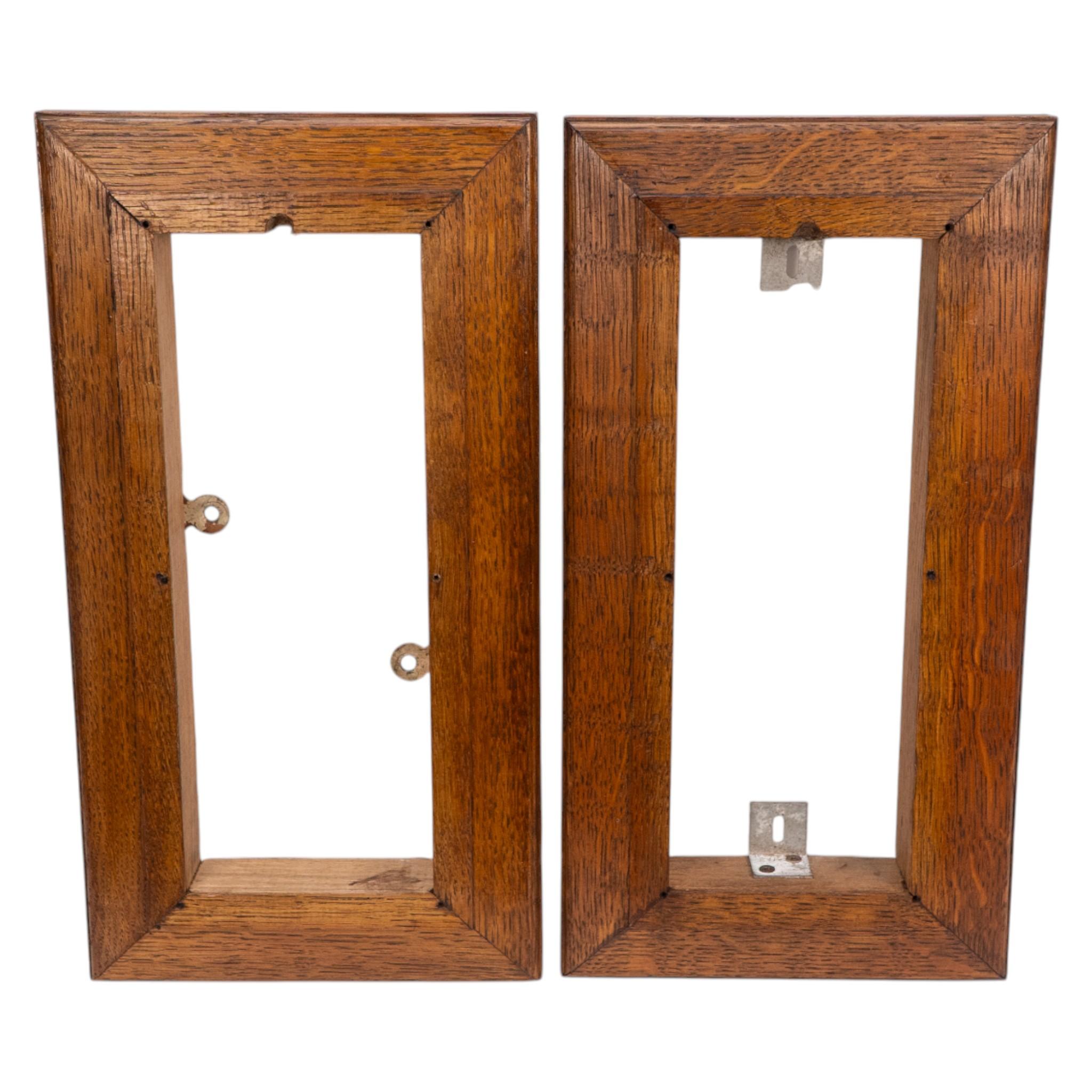 20th Century Birmingham Guild of Handicraft. A pair of Arts & Crafts bronze wall lights For Sale