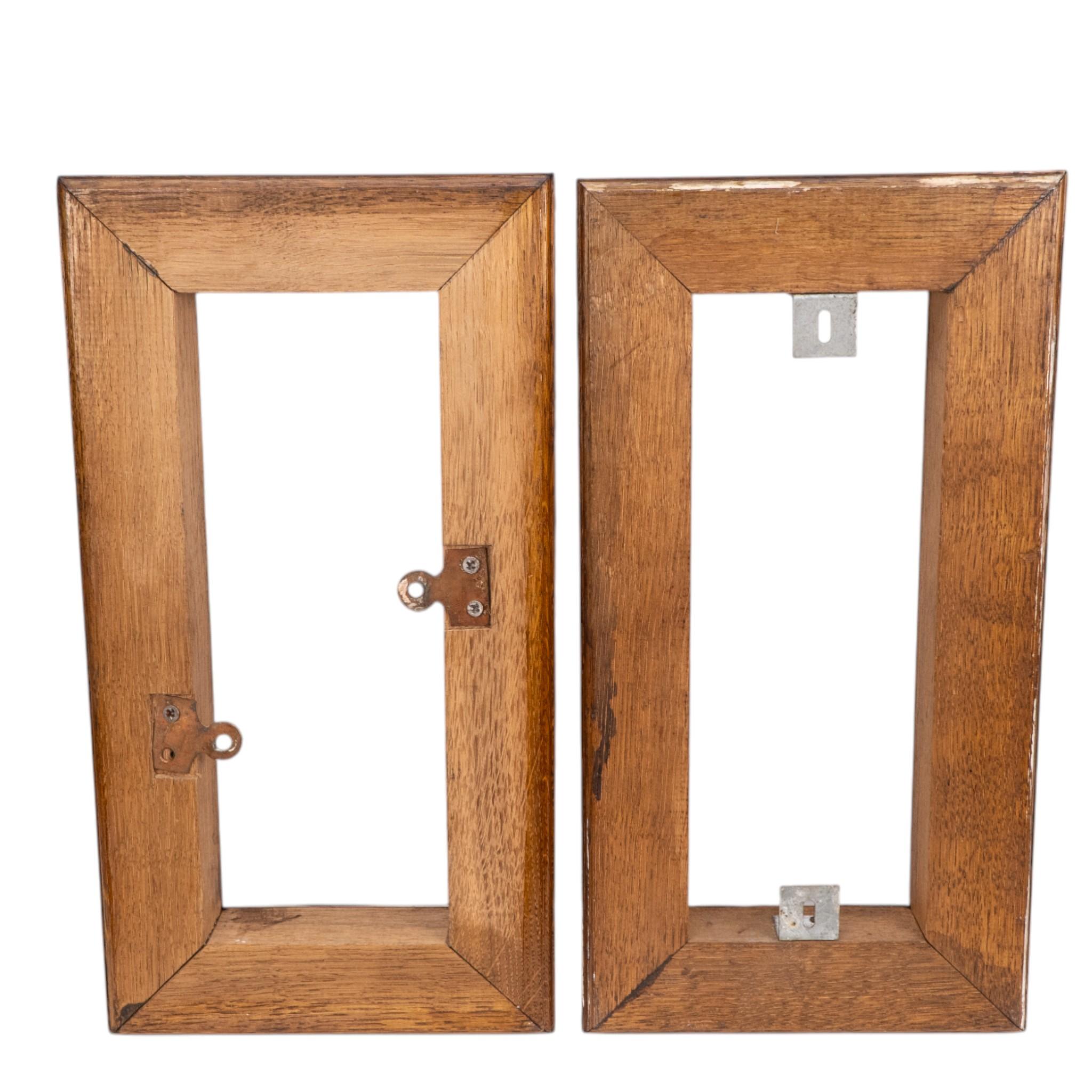 Oak Birmingham Guild of Handicraft. A pair of Arts & Crafts bronze wall lights For Sale