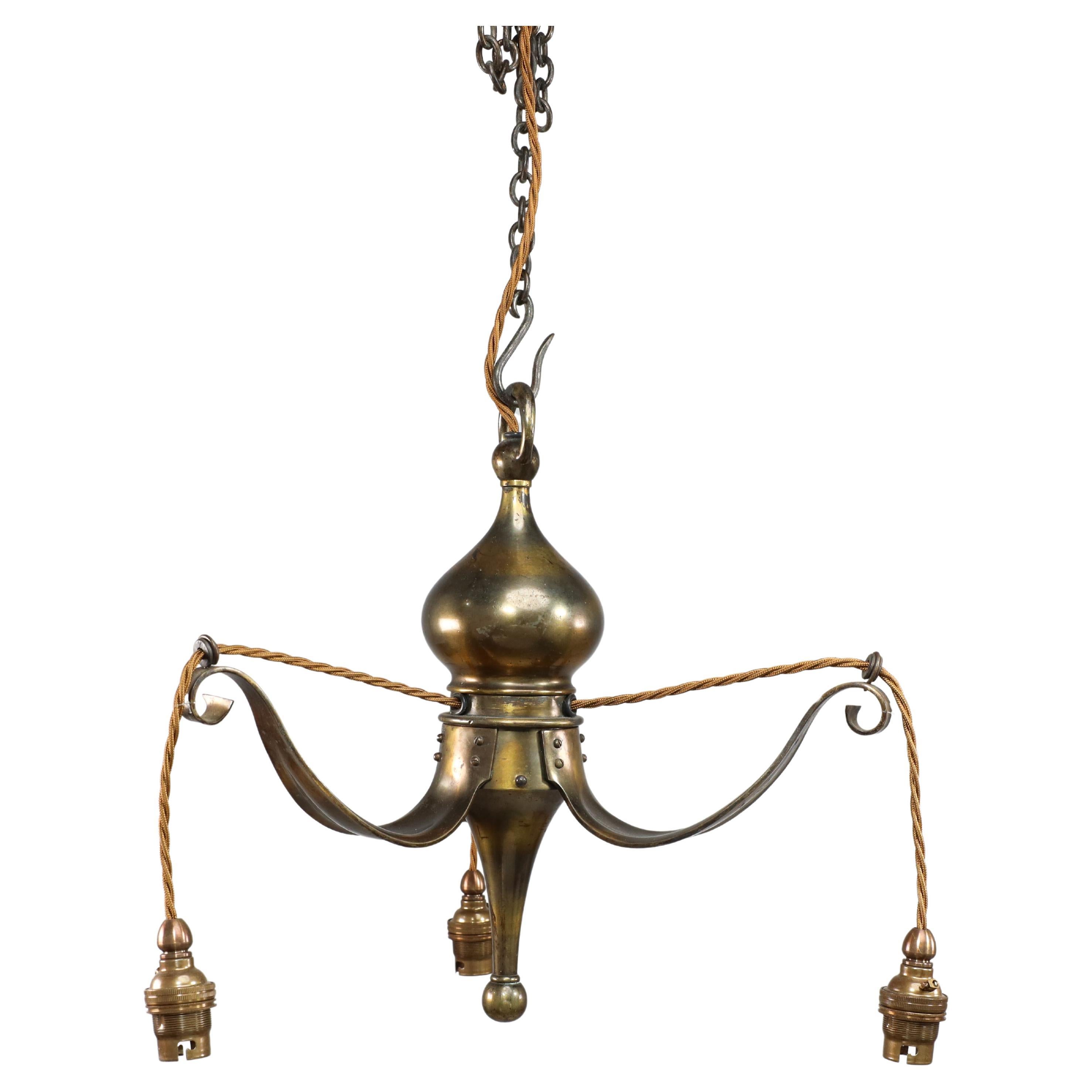 Birmingham Guild of Handicraft. An Arts and Crafts three arm brass ceiling light For Sale