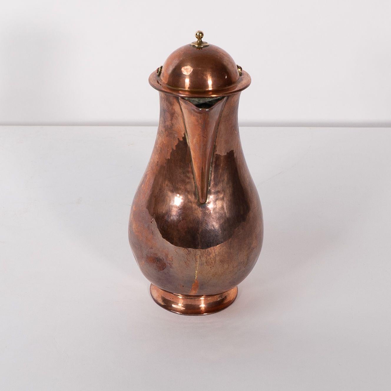 Arts and Crafts Birmingham Guild of Handicraft. An Arts & Crafts copper and brass chocolate jug For Sale