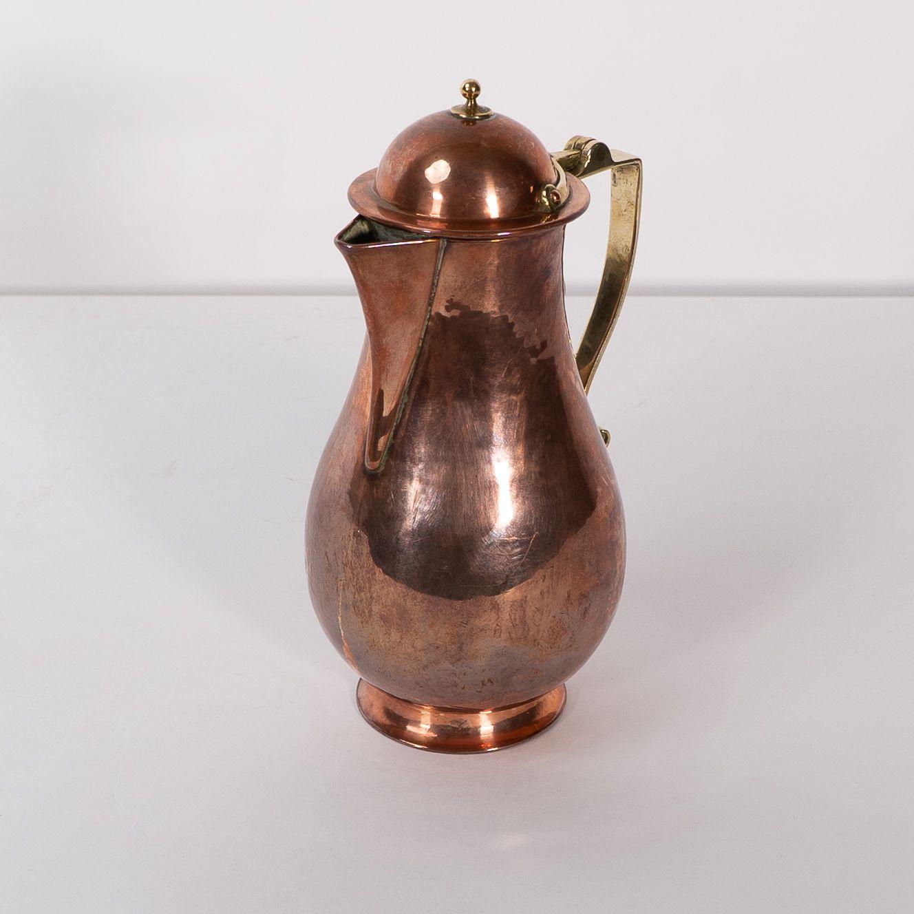 British Birmingham Guild of Handicraft. An Arts & Crafts copper and brass chocolate jug For Sale