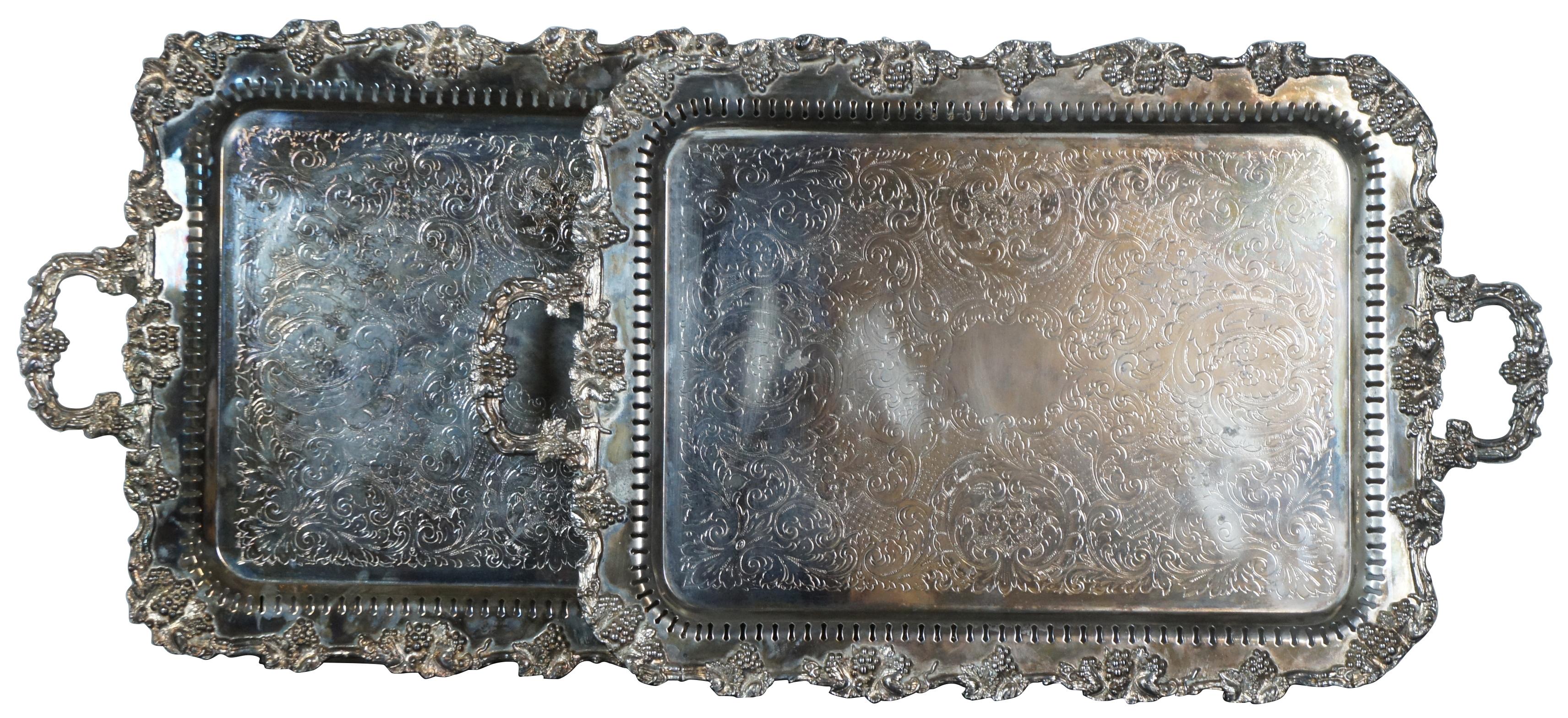 Extra large Birmingham Silver Company silverplated (silver on copper) butler tea tray or serving platter. Circa 1960s  Features a scalloped floral and grape vine design with an engraved floral surface, reticulated border with handles and footed