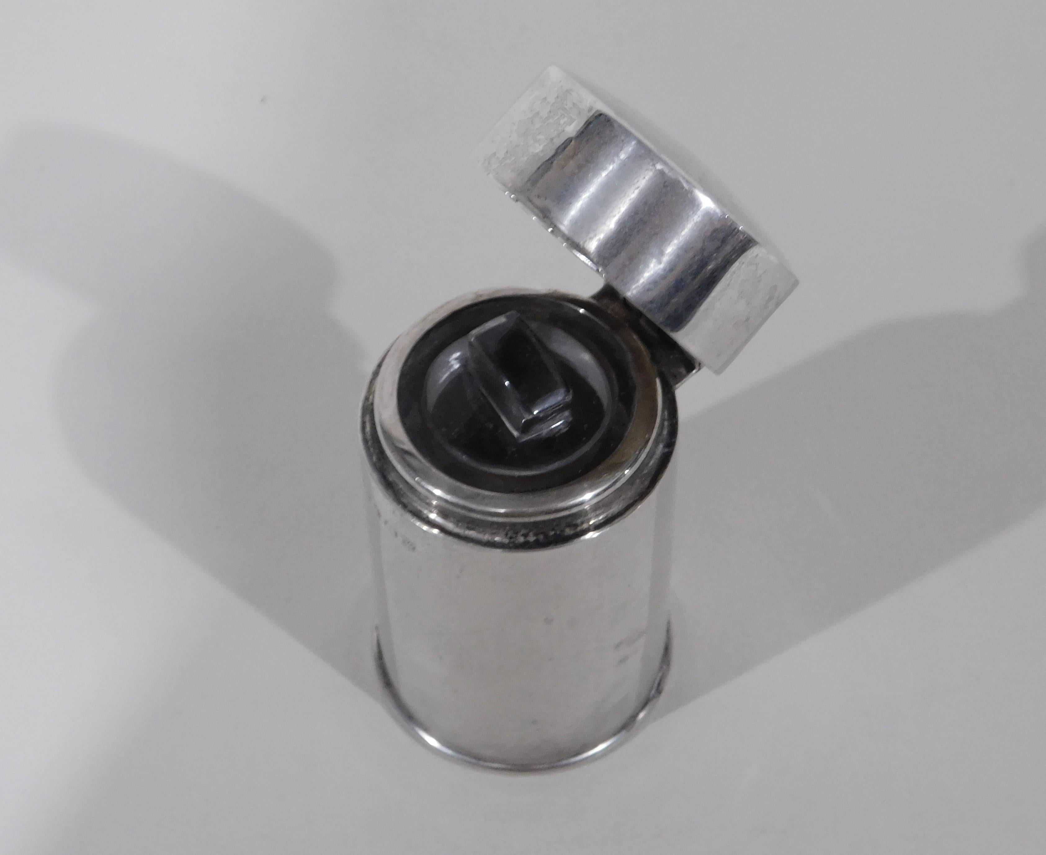 English sterling silver scent bottle by Joseph Cook & Son, hallmarked from Birmingham in 1921. Perfume bottle with hinged top and glass inner lid/stopper.