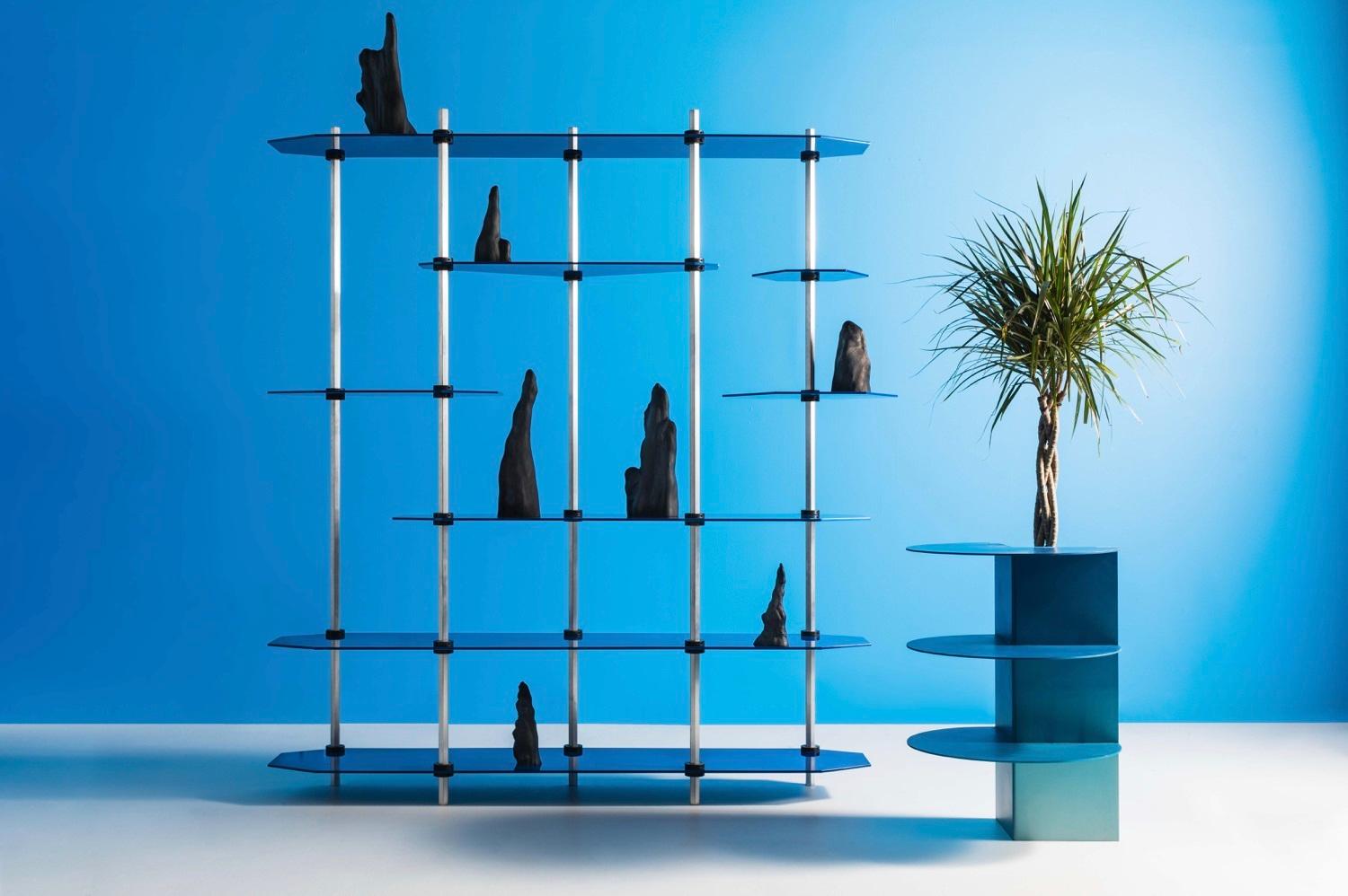 This handmade bookshelf is made of aluminum and resin by Birnam Wood Studio in New York. This contemporary shelving design is heavily influence by geometric shapes and futuristic aesthetic. The open display of the shelving allows one to openly