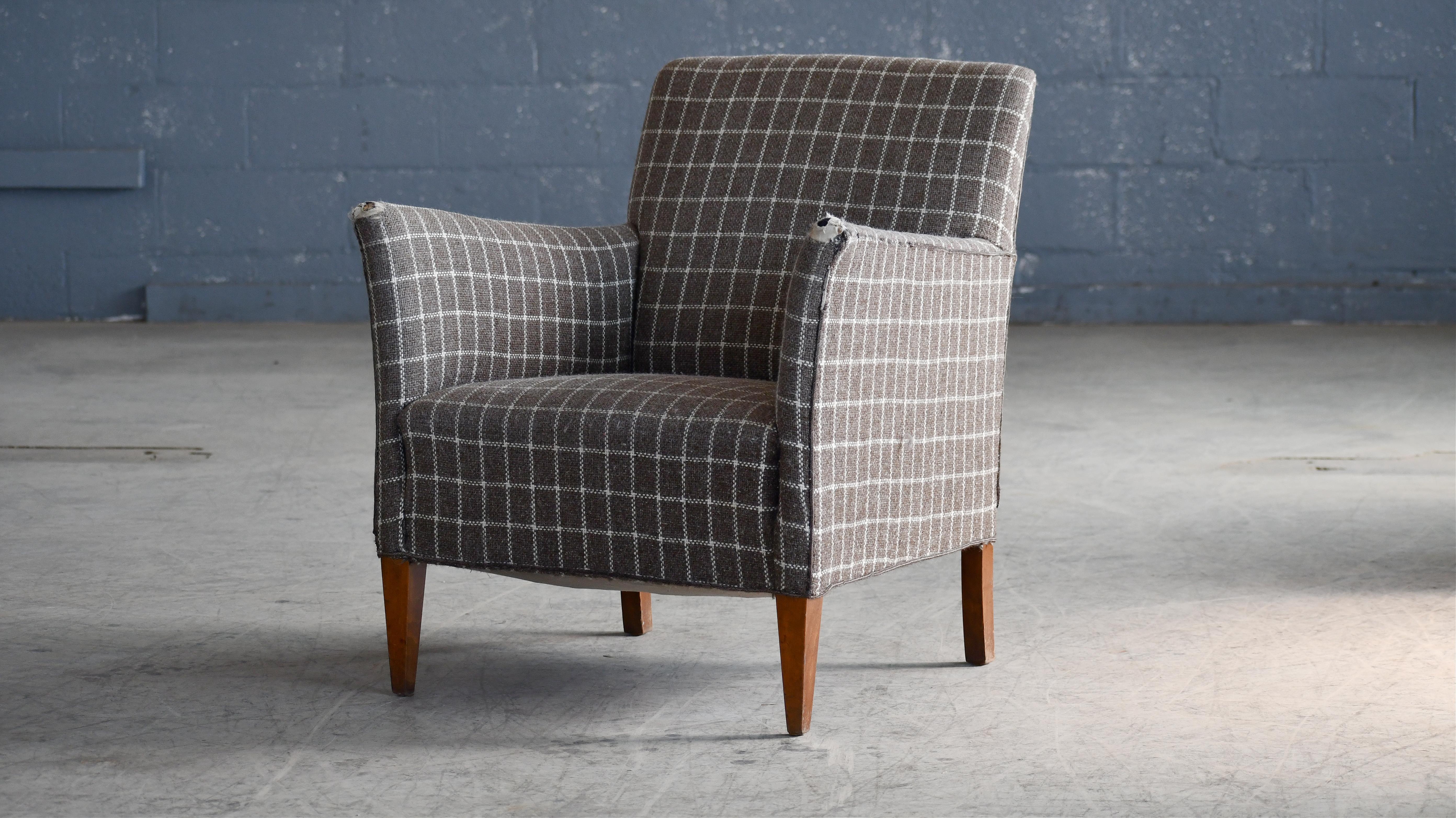 Elegant Danish small scale lounge chairs in the style of Birte Iversen and made in Denmark sometime in the 1950's. Super elegant very versatile design solid and sturdy construction. Beech frame raised on teak legs. The fabric is worn and need to get