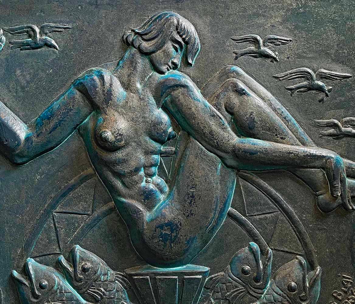 Highly rare and striking, this high relief Art Deco sculptural panel features a nude Venus figure at its center, surrounding by spouting fish and flying birds.  The sculptor was Boris Blai, an important artist who studied in Kiev, St. Petersburg,