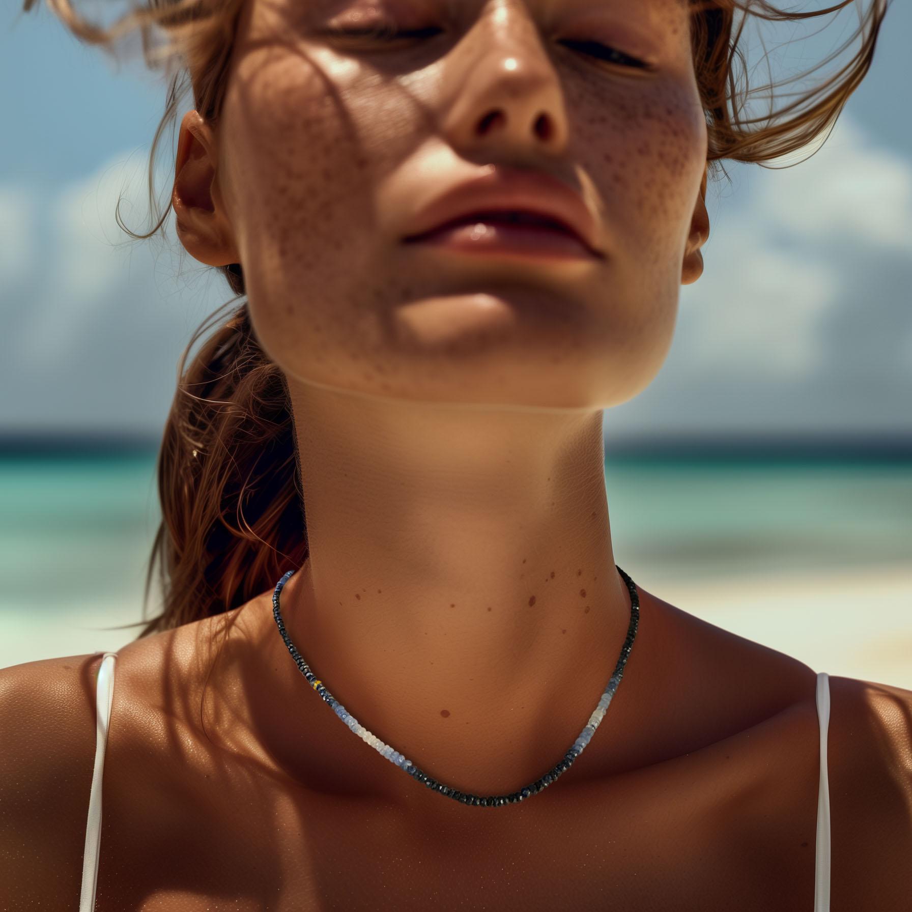 Make an unforgettable impression with the Blue Sapphire Ombré Necklace, a radiant tribute to September's celestial birthstone. Featuring faceted sapphire rondelles that transition from deep midnight blues to soft sky hues, this piece is elevated