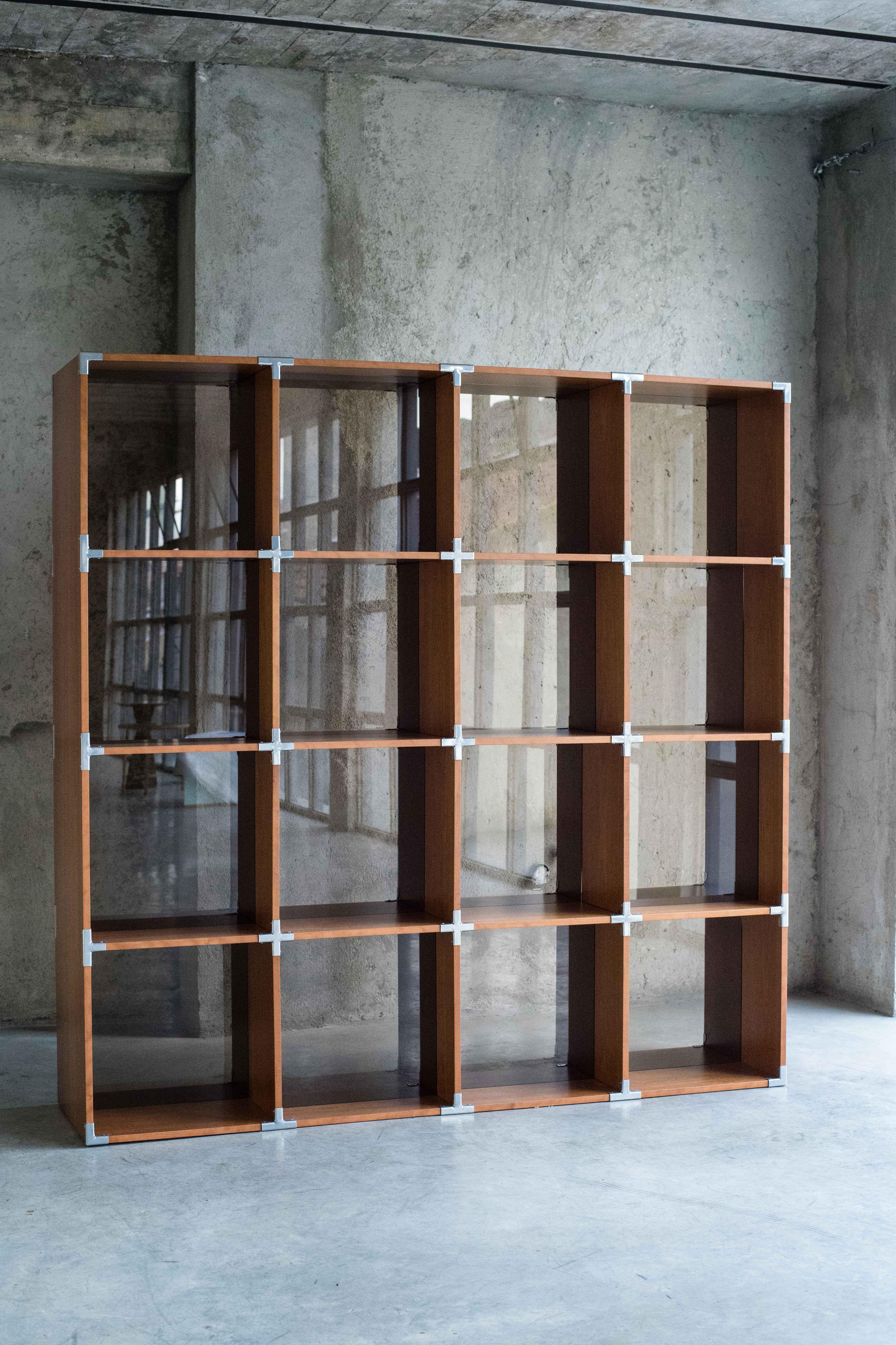 BIS bookshelf by MOB 
Limited editions of 15 + 1 prototype
Designer: Benjamin Ossa (Chile)
Dimensions: H 210 x D 50 x W 210 cm
Material: Cherry tree veneer 18mm, steel chrome unions, reflective brown glass

The BIS project for MOB seeks to be