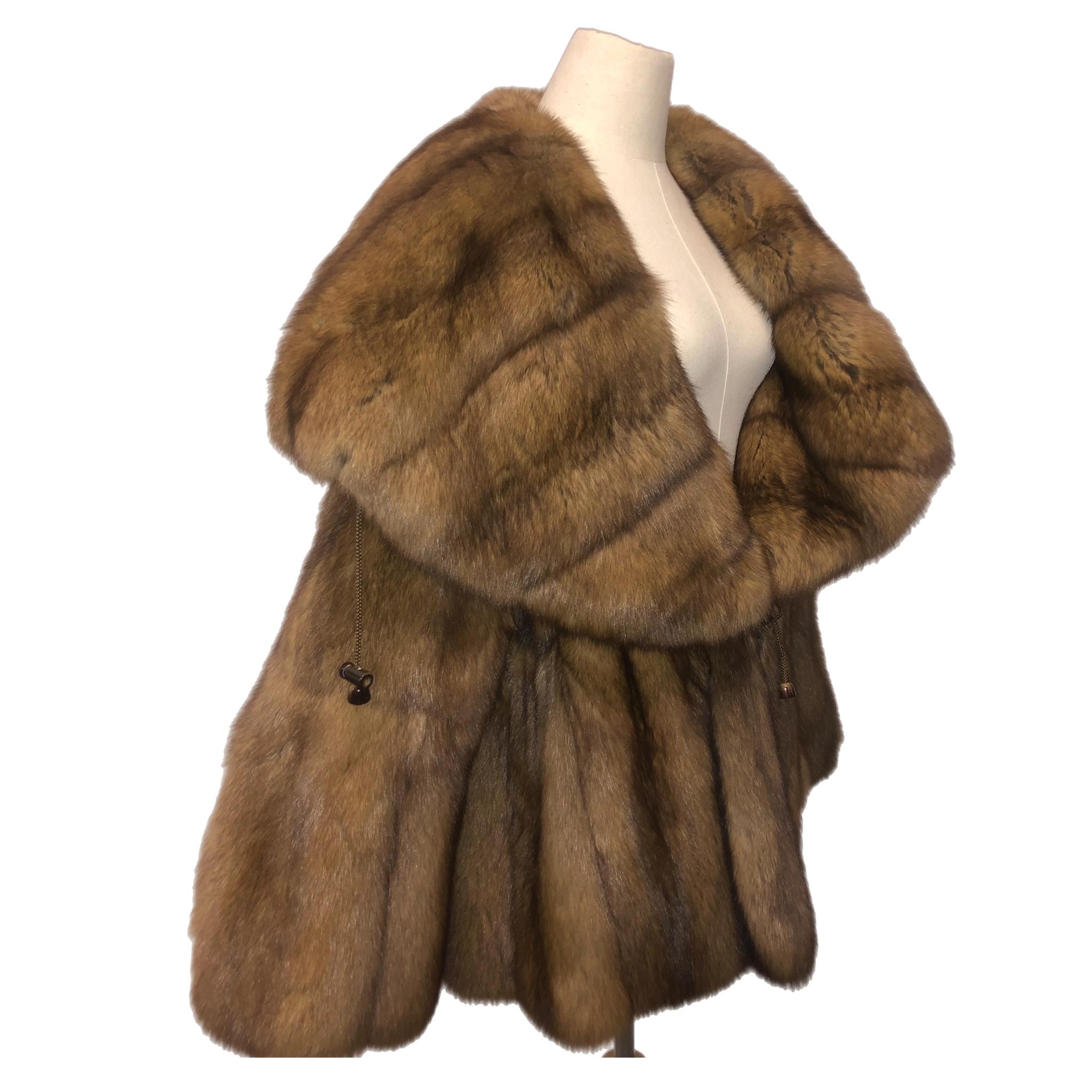 PRODUCT DESCRIPTION: 
Brand new Bisang sobol Russian Sable fur coat size 14-18
This beautiful rare find is made of full skins fluffy Russian sable fur, always kept in frozen vault, pristine condition never worn with tags the lining is brand new, the
